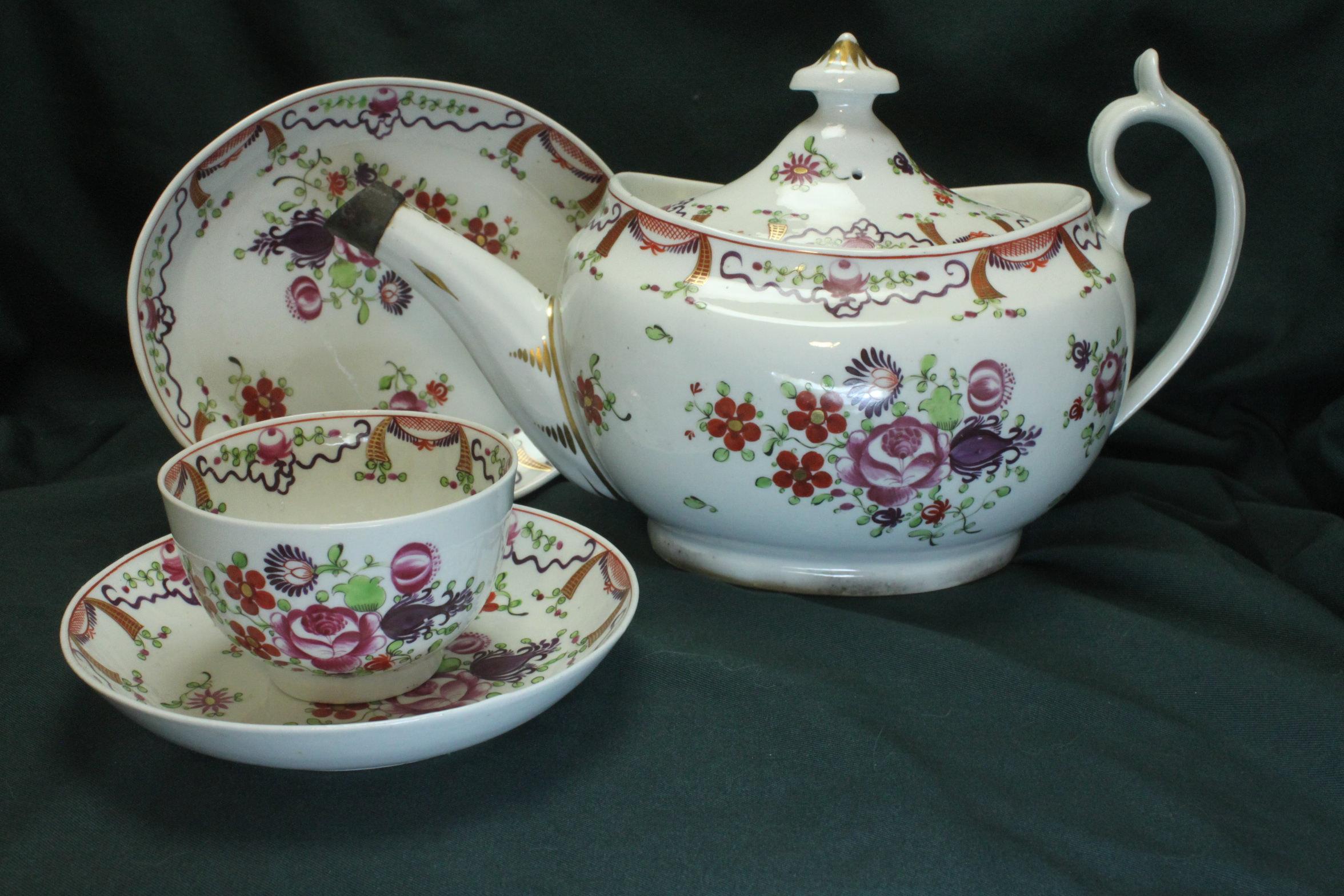 This Chamberlain's Worcester porcelain hand painted and gilded tea set consists of 31 pieces- a teapot and stand, a lidded sugar box, milk jug, slop bowl, two cake plates and twelve tea bowls and twelve saucers. The pattern, 351, on Chamberlain's