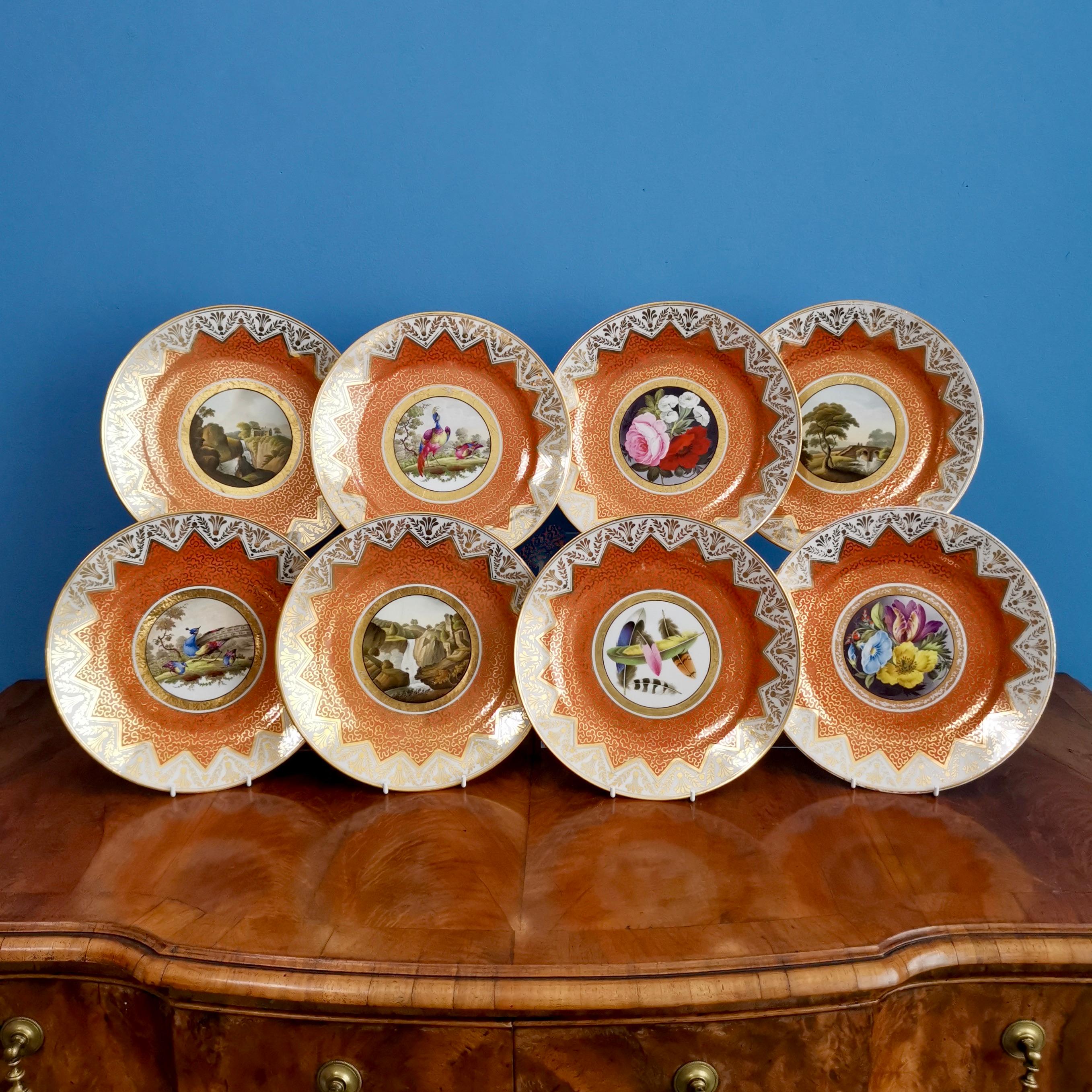 This is a stunning set of 8 dessert plates made by Chamberlains Worcester in about 1815. The plates are decorated with a deep orange ground with 