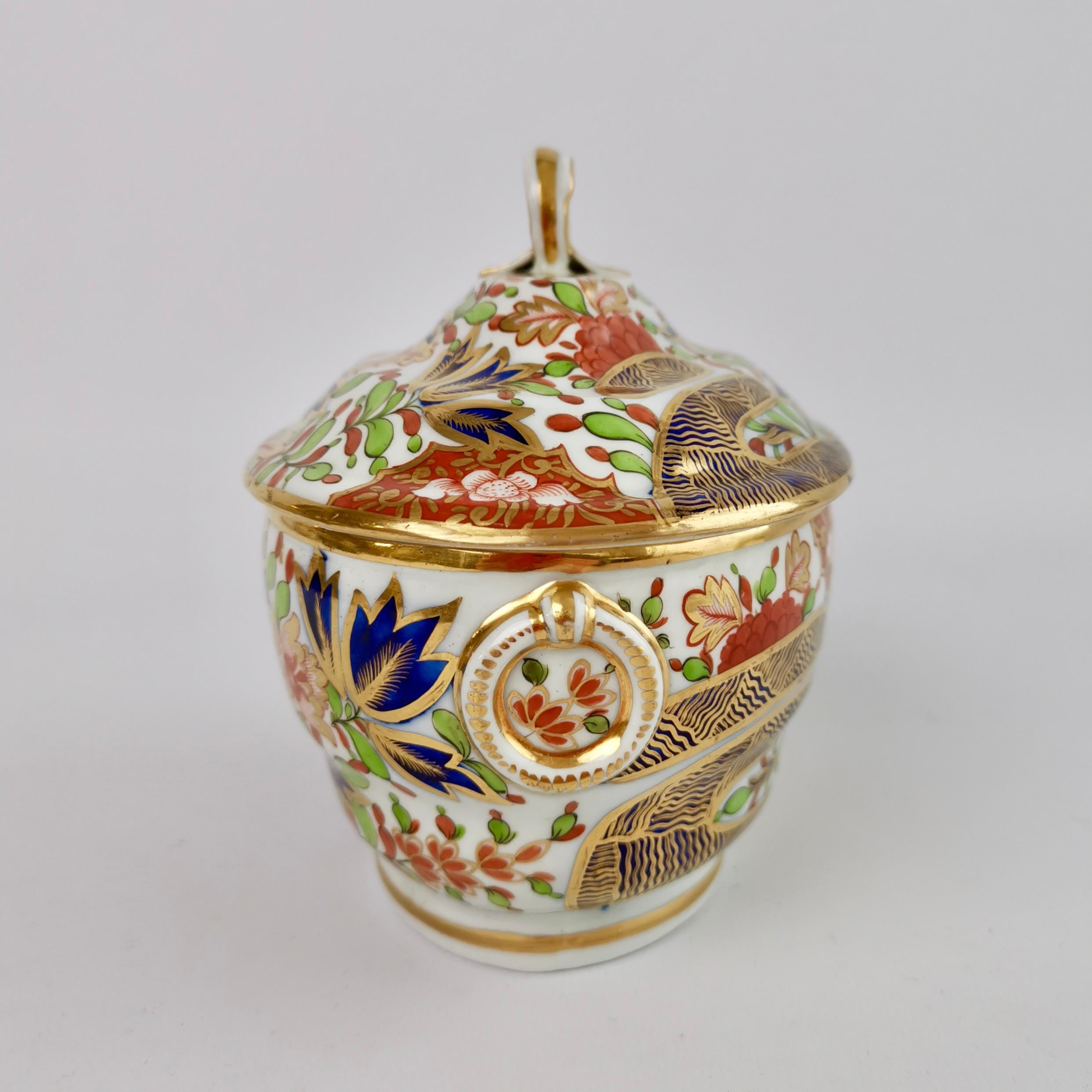 This is a beautiful sucrier and cover, or sugar pot, made by Chamberlains Worcester between 1802 and 1805. It is decorated with the very famous 