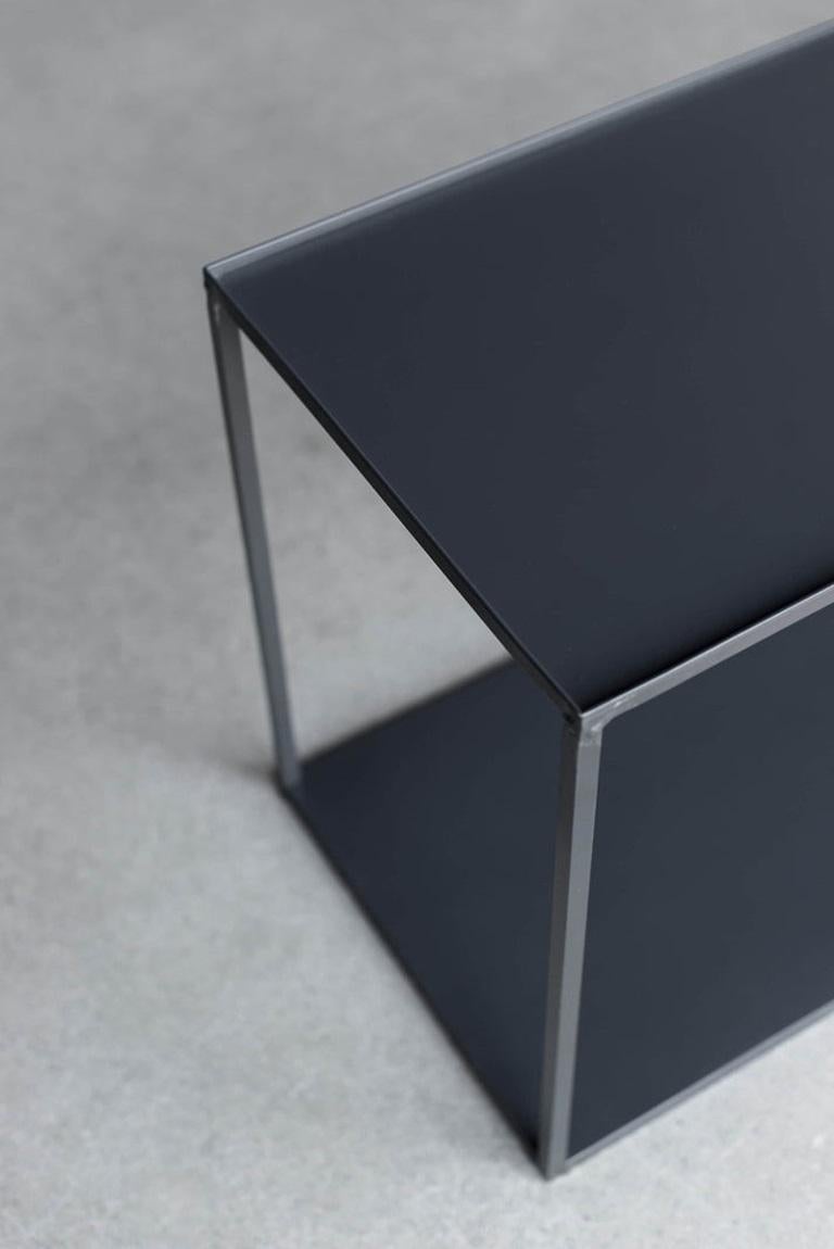 The Chambers Console is a low-profile piece that combines industrial and contemporary design. Crafted from solid steel, the console features a two-tiered design that provides ample storage space. Both the top and bottom shelf are sheered sheet