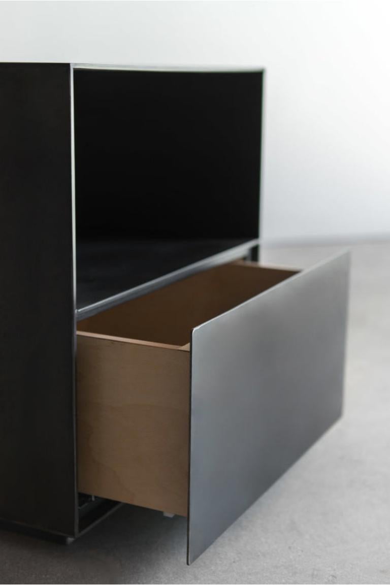 This Chambers Nightstand is custom made in Los Angeles. Sheered, sheet metal casing is attached to plywood substrate. Drawer is built and fit to size.

INDUSTRIAL STEEL + BIRCH, POWDER COATED FINISH
CUSTOMIZE THIS PIECE

For all furniture,