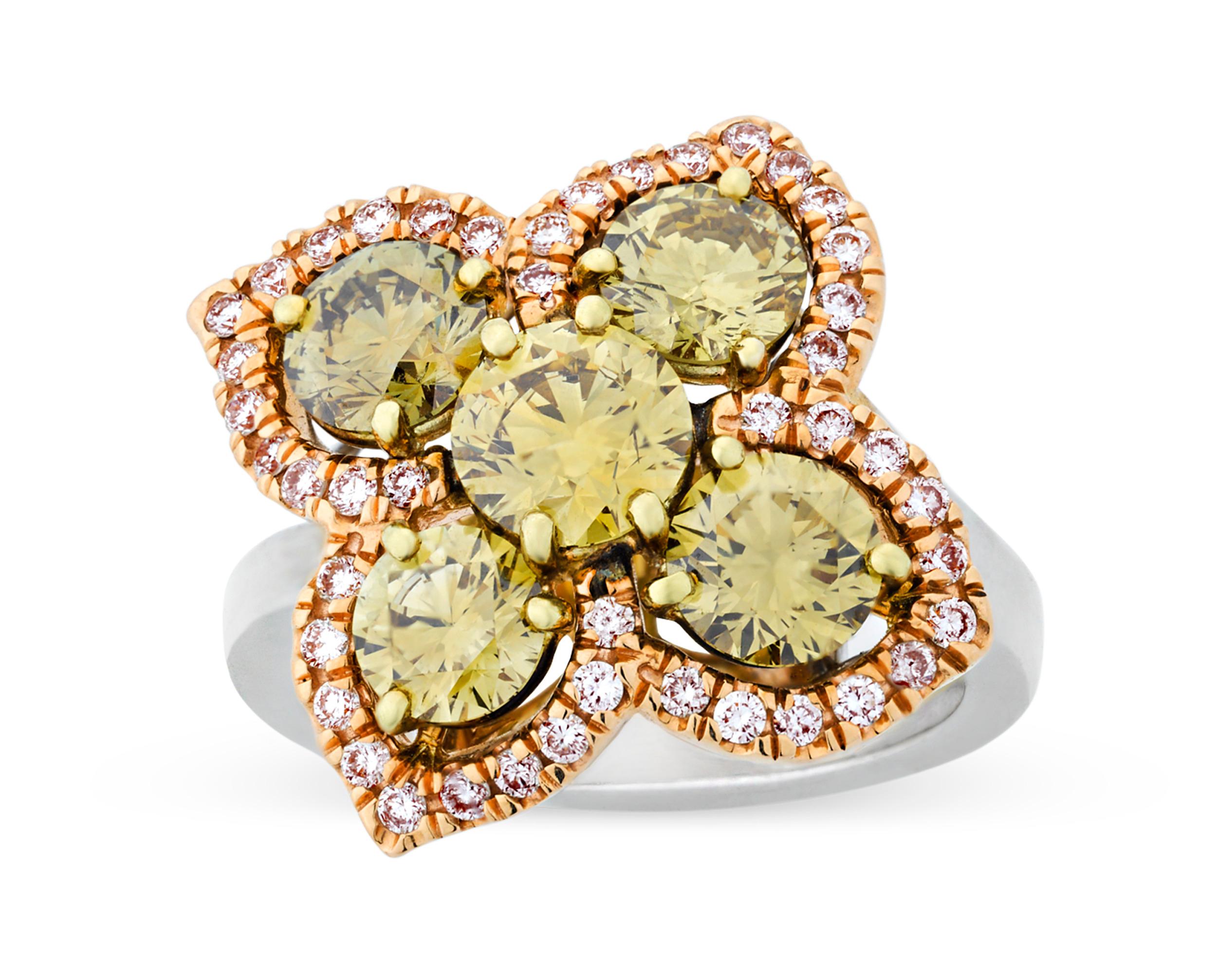 Chameleon diamonds are the rarest and most sought after of the fancy colored diamonds, and they are the only natural colored diamonds with the ability to change color. This stunning floral-shaped ring contains not one, but five of these remarkably