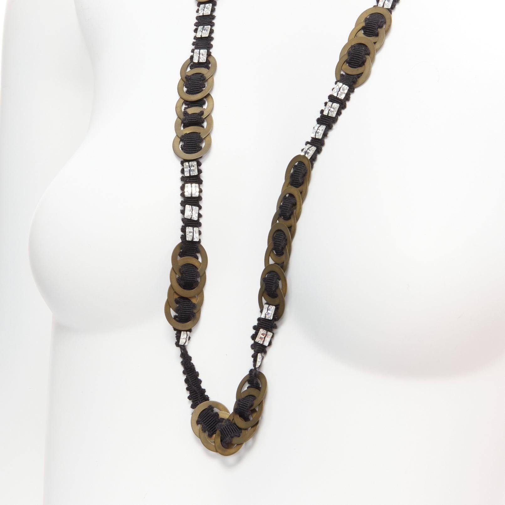 CHAMOREL black grosgrain ribbon clear crystal bronze rings long necklace
Reference: SNKO/A00344
Brand: Chamorel
Material: Metal, Fabric
Color: Black, Bronze
Pattern: Solid
Closure: Self Tie

CONDITION:
Condition: Excellent, this item was pre-owned