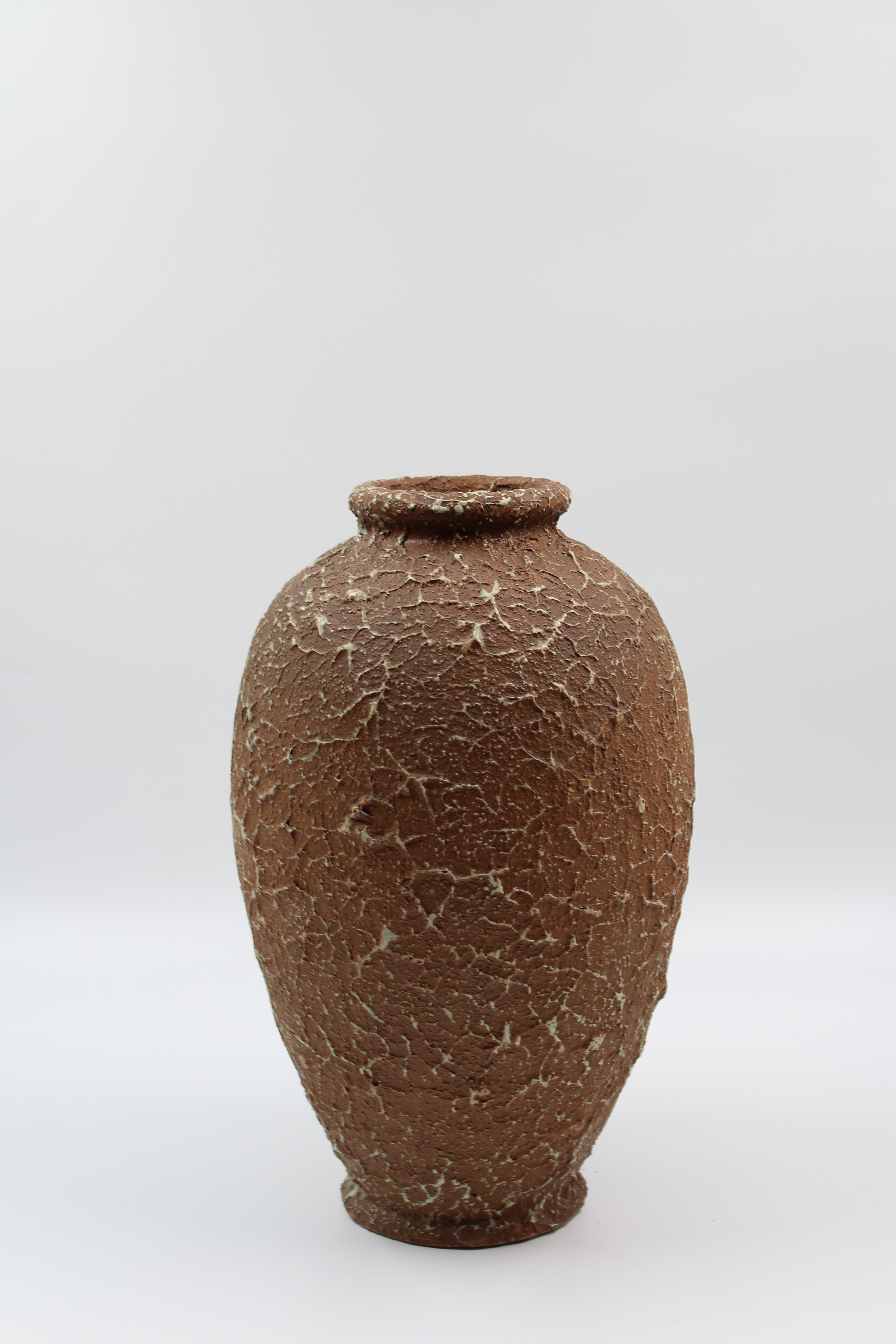 A ceramic vase, made with the chamotte technique, by the Swedish company Andersson & Johansson at Höganäs Keramik. The stamp dates the vase to between 1920 and 1958. Beautiful and very decorative object in very good vintage condition.