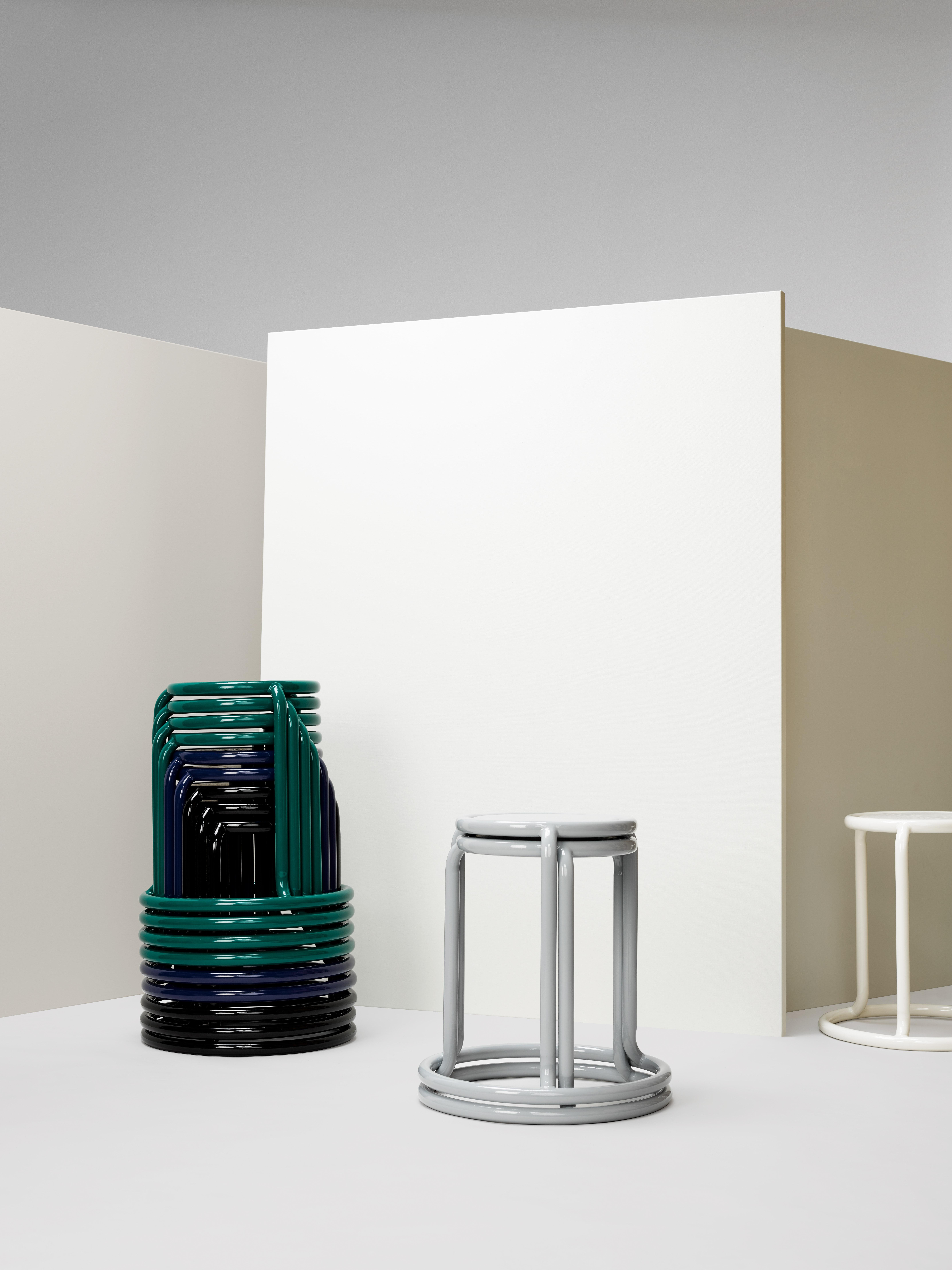 Champ is a reimagining of the utilitarian stackable stool. When stored, the stools form a graceful and graphic upward spiral. Taking cues from the original champ stool, the collection has grown to include a counter height stool, barstool and cafe