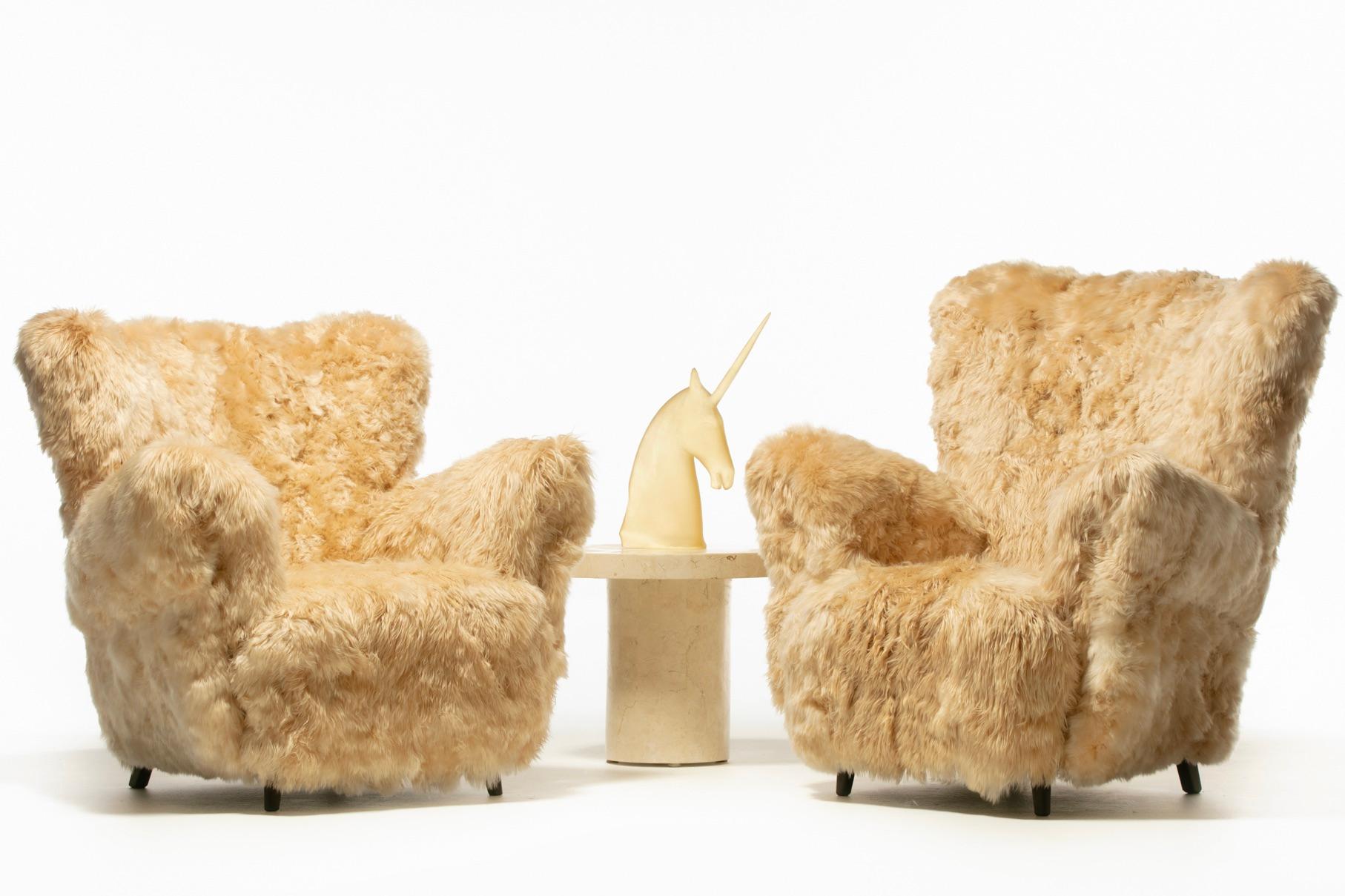 Scrumptiously soft pair of Art Deco Mom and Pop 1930s Wingback chairs newly professionally reupholstered with hand sewn champagne Alpaca hides responsibly sourced from the Lake Titicaca Valley in Peru. Alpaca is considered the softest hide in the