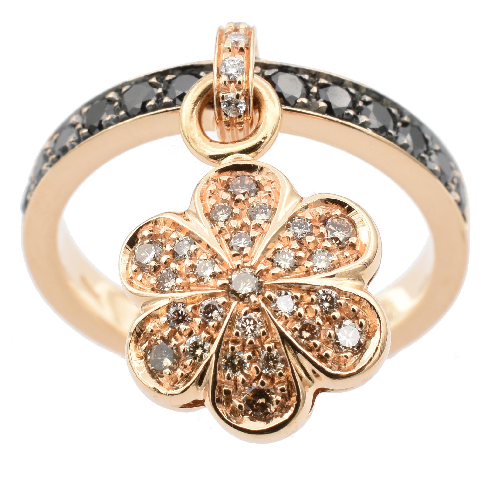 18 Kt Rose Gold Ring with Pendant Flower Charm. This Charm is set in both sides with Champagne Diamonds and hangs freely on the ring.
A very Funny and Happy Ring that perfectly match with a wedding ring for an everyday use.
Handmade in Italy in or