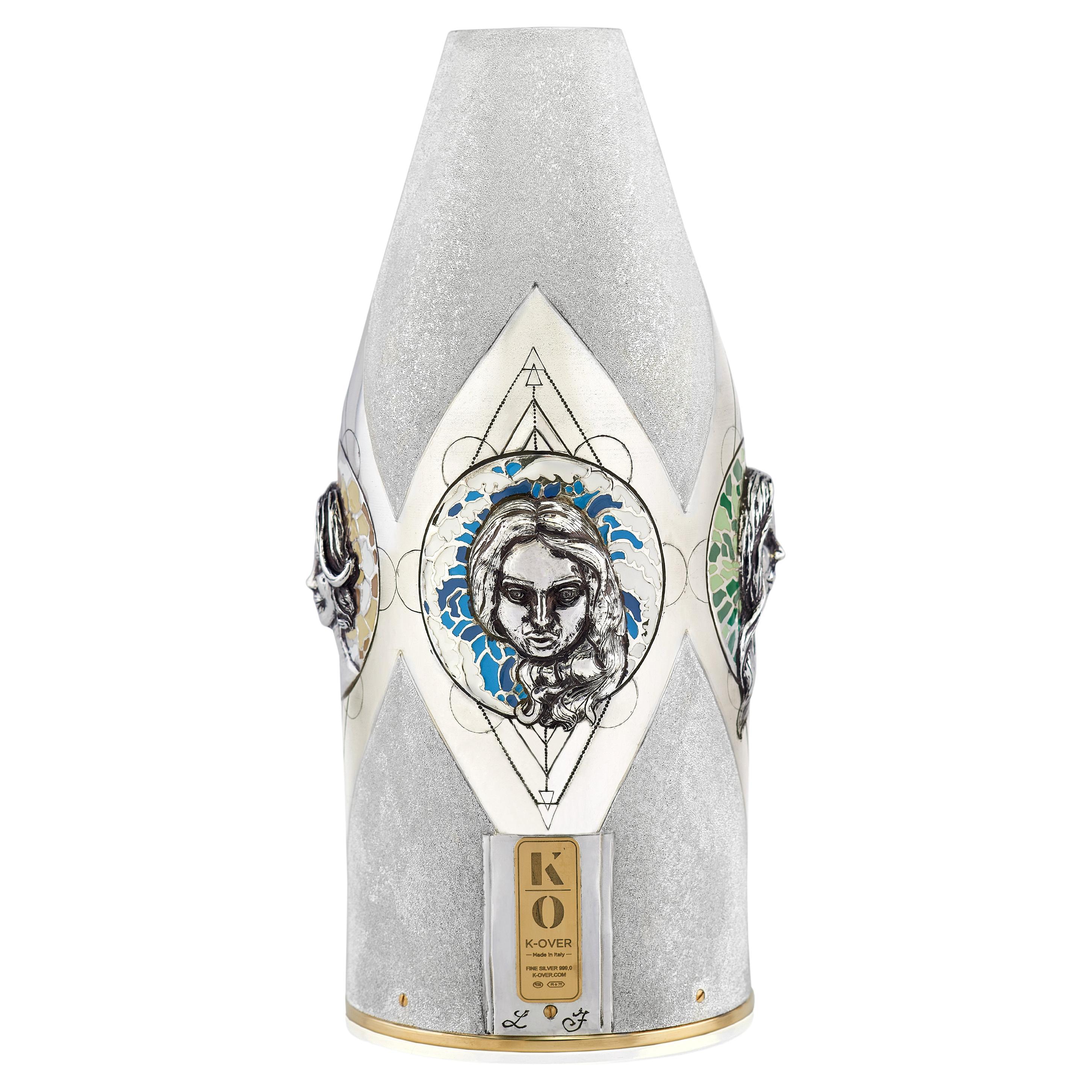 This champagne bottle cover is a distinguished new piece from our Works of Art Collection, showcasing the vision of the artist of the 4  elements of the Cosmos : earth, water, fire, air. In the Hellenic tradition, the four elements are the realms of