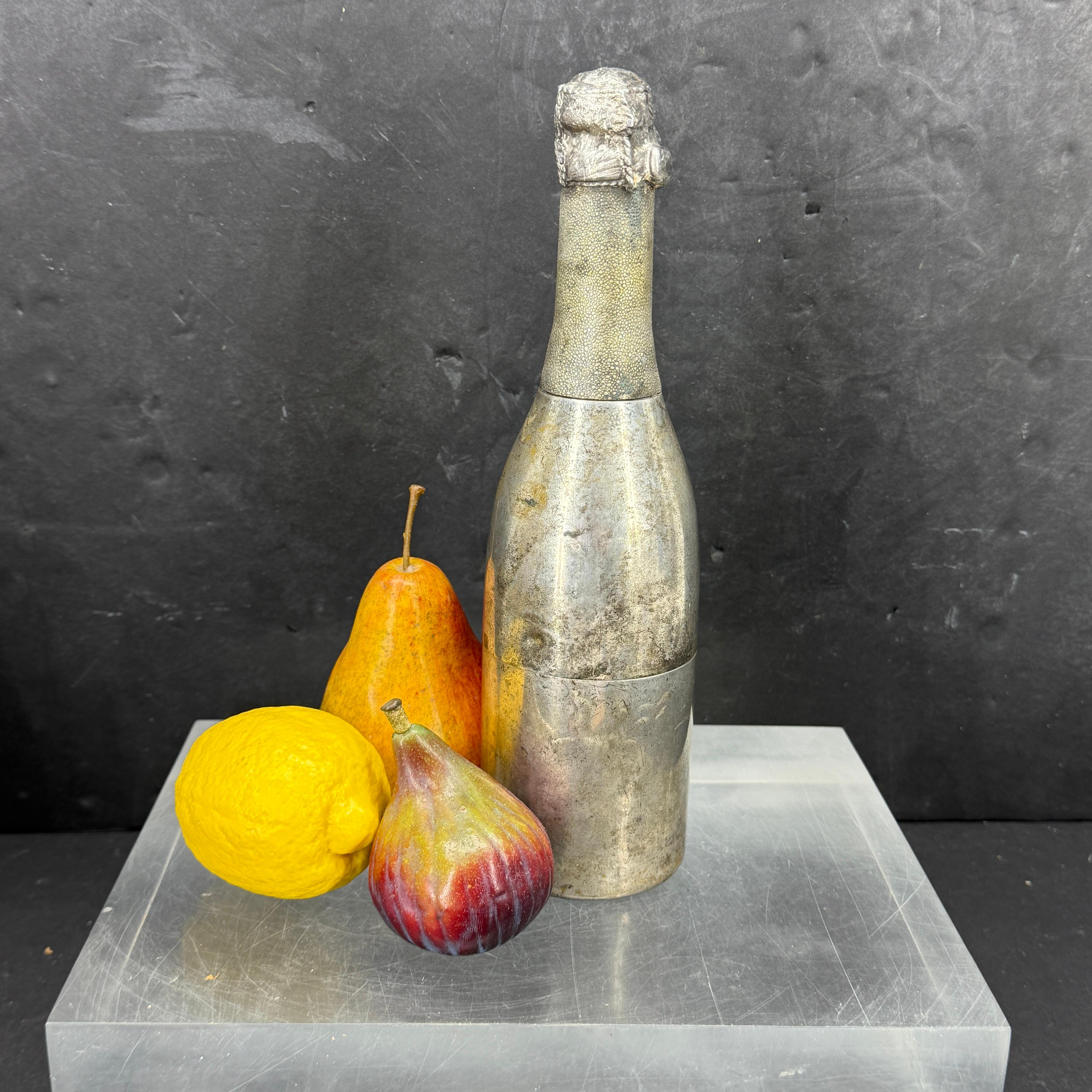 Lots of character and detail on this metal Champagne bottle cocktail shaker we found in a Paris market. The sculpture is certainly functional but we also see this piece as a stand alone on a bar area. A conversation piece for sure!