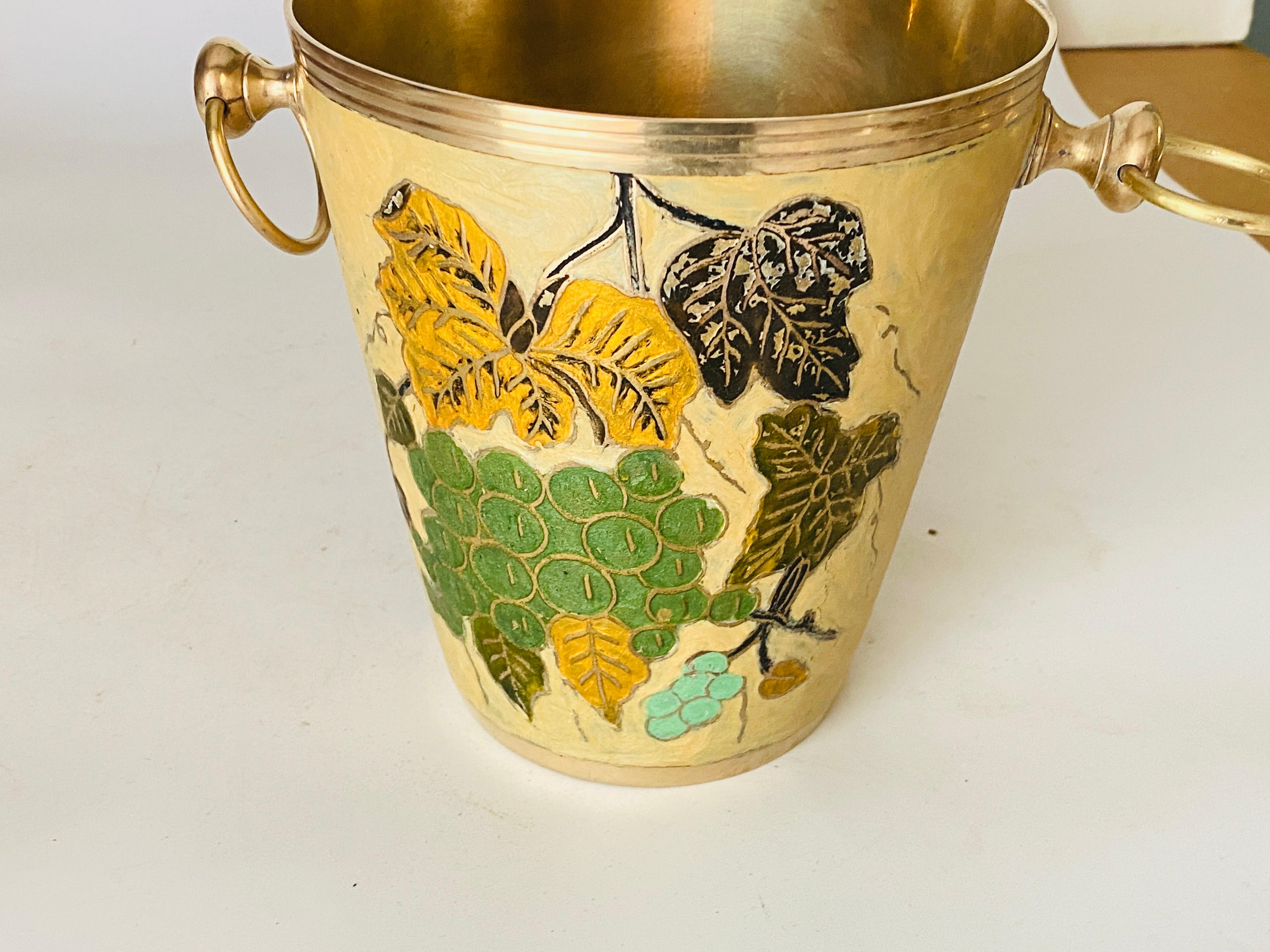Champagne bucket with colored floral decor frame.
Champagne cooler.
Ice bucket.
Brass and hand painted ceramic cloisonné.