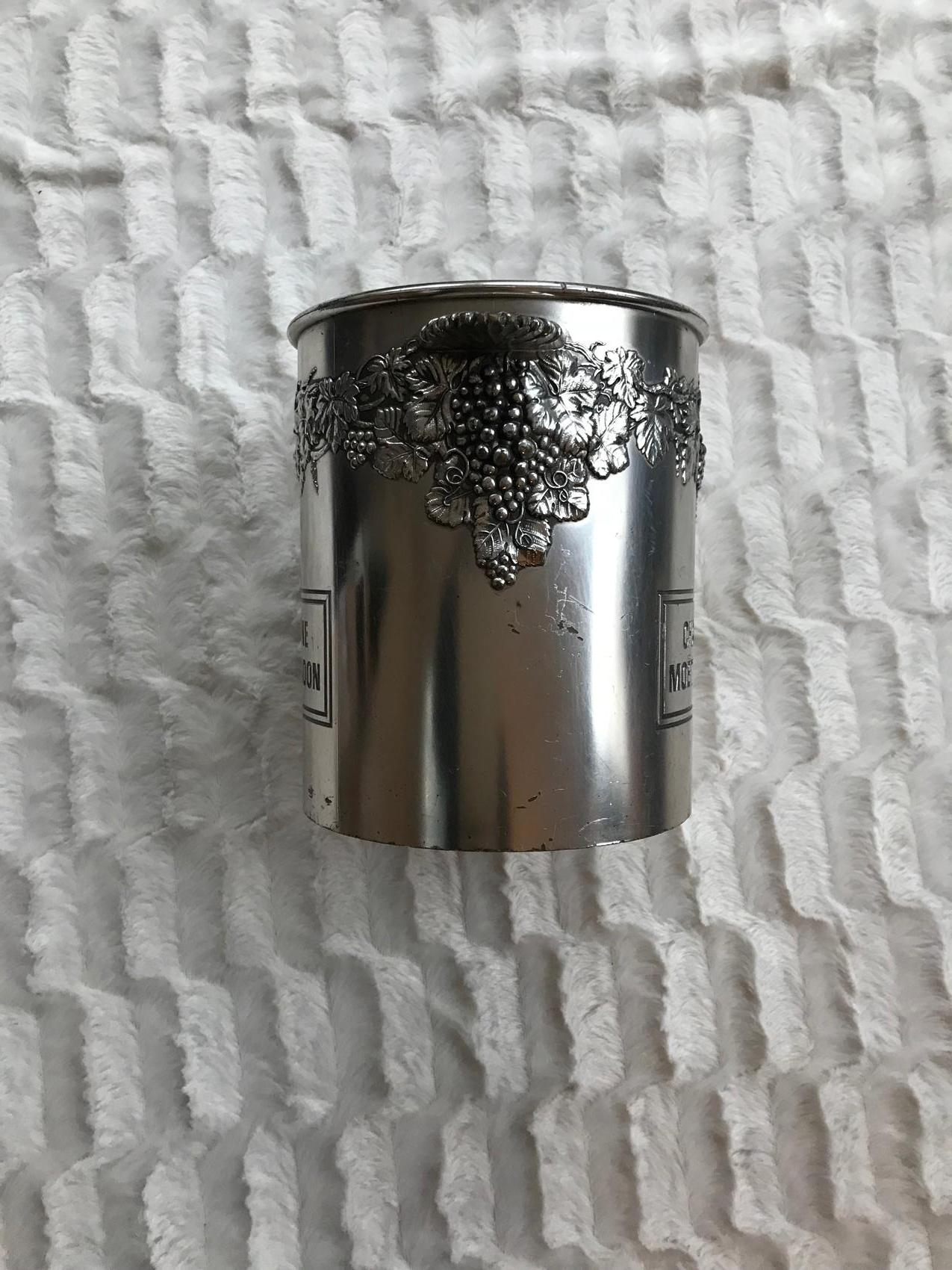 Moet Chandon champagne ice bucket cooler, nicely decorated all around with grapes and vine leaves. Very nice holders.



   