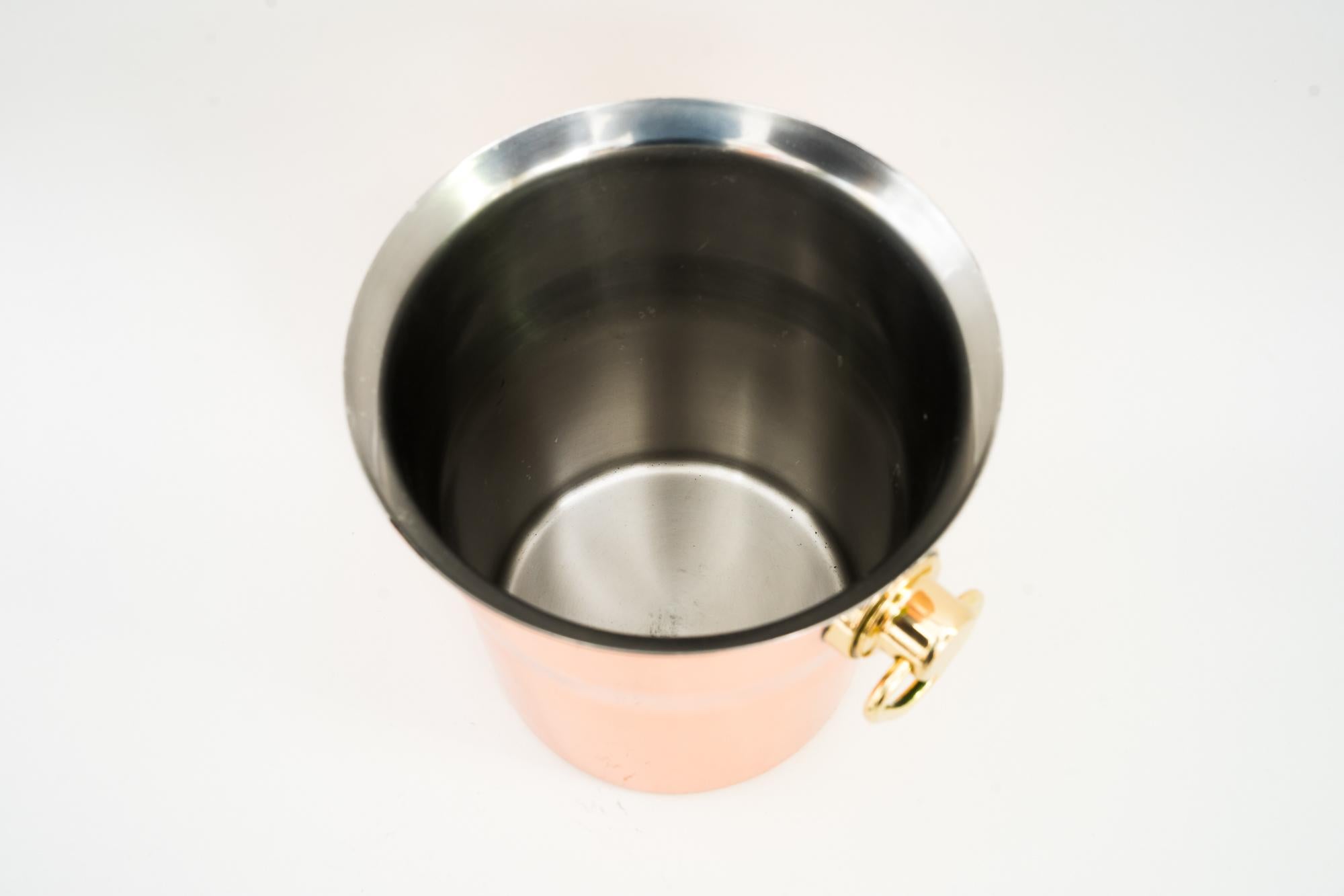 Champagne Bucket copper and brass Switzerland around, 1950s
Polished and stove enamelled.