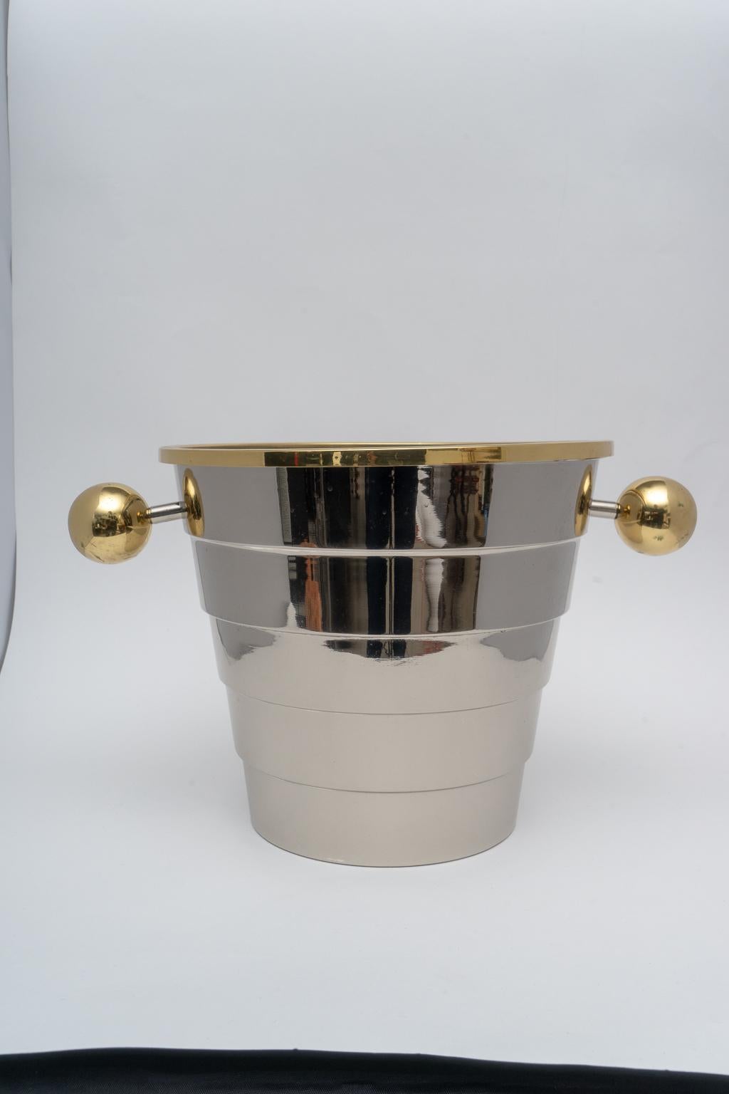 This stylish brass and stainless steel Art Deco style ice bucked was designed by Larry Laslo for Towle and it dates to the 1980s.

Note: This piece has been professionally polished.