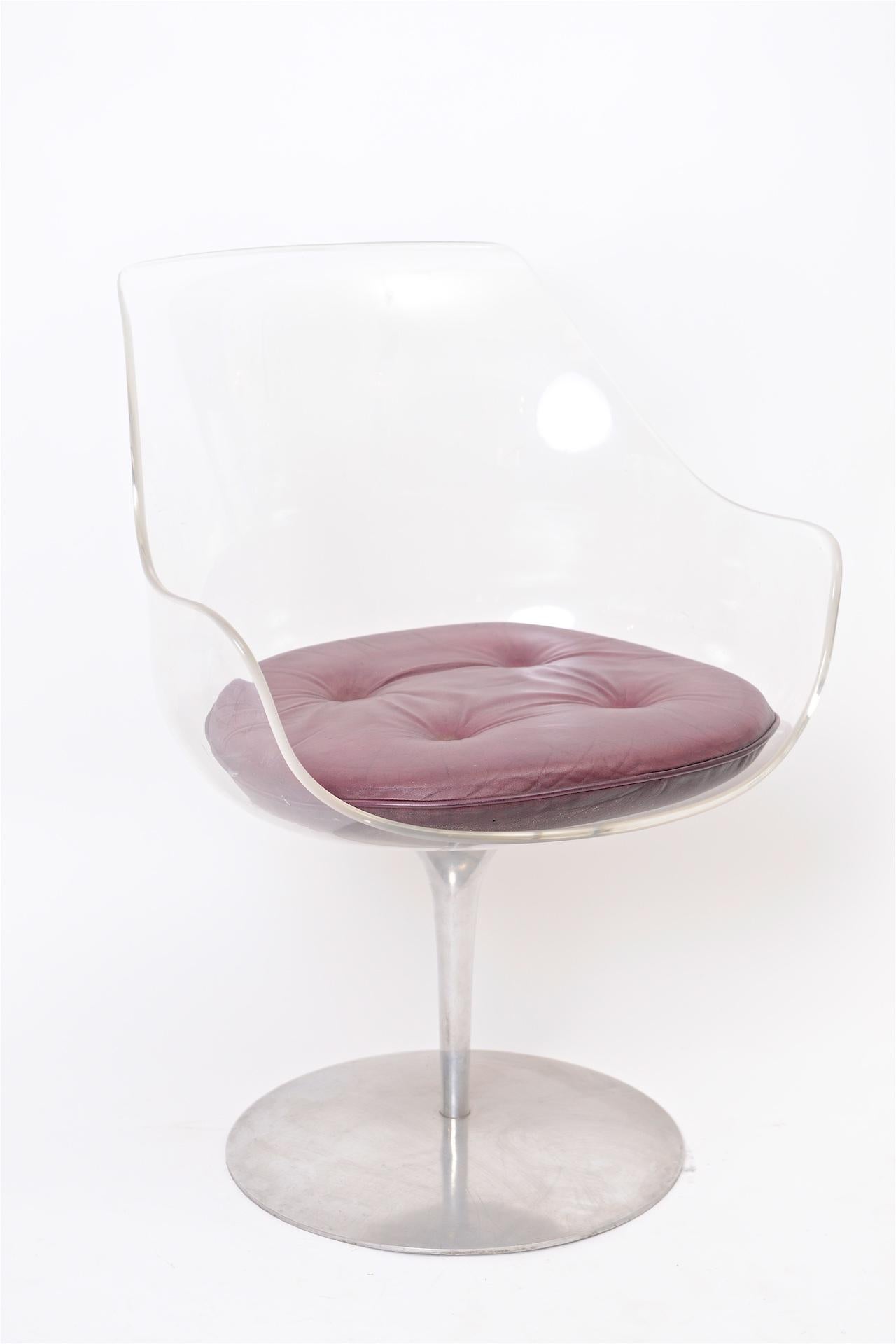 Moulded Lucite with leather cushion on sprung auto return revolving aluminium base.

Lucite is in excellent condition.

    