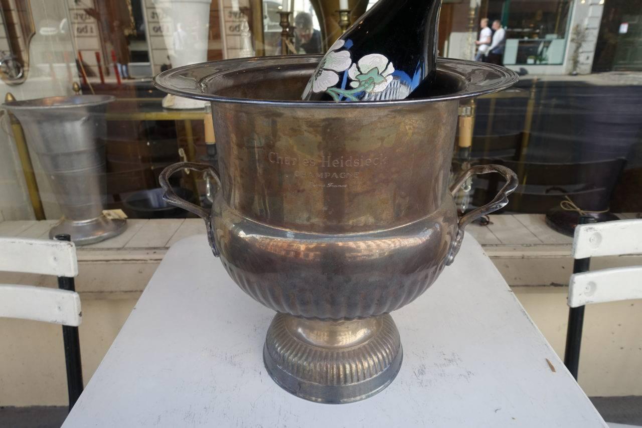 Large and imposing vintage French champagne cooler / ice bucket / centrepiece. Silver plate on brass with stunning patina. Provenance - the illustrious champagne house of Charles Heidsiecks, whose name is also engraved on the sides. Stunning