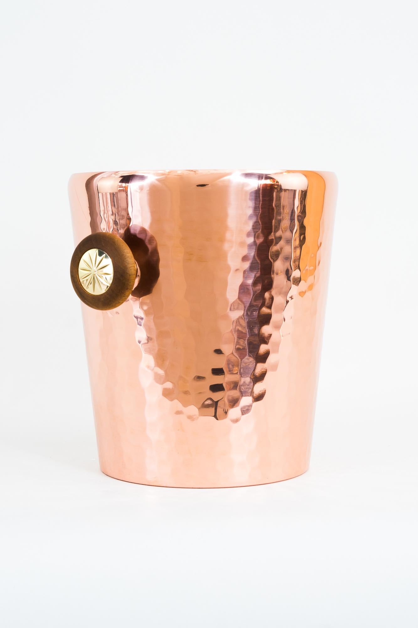 Champagne cooler, Vienna, 1950s
Hammered copper 
Brass and wood 
polished and stove enameled.