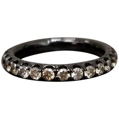 Eternità con diamante champagne in rodio nero