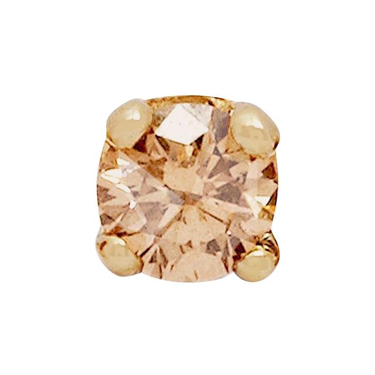 A pair of parkling champagne diamond stud earrings set in 9-carat yellow gold.  This listing is for a pair of stud earrings, each stud features a 0.03 carat round brilliant cut champagne diamond.  Measuring approximately 2 mm in diameter, this is