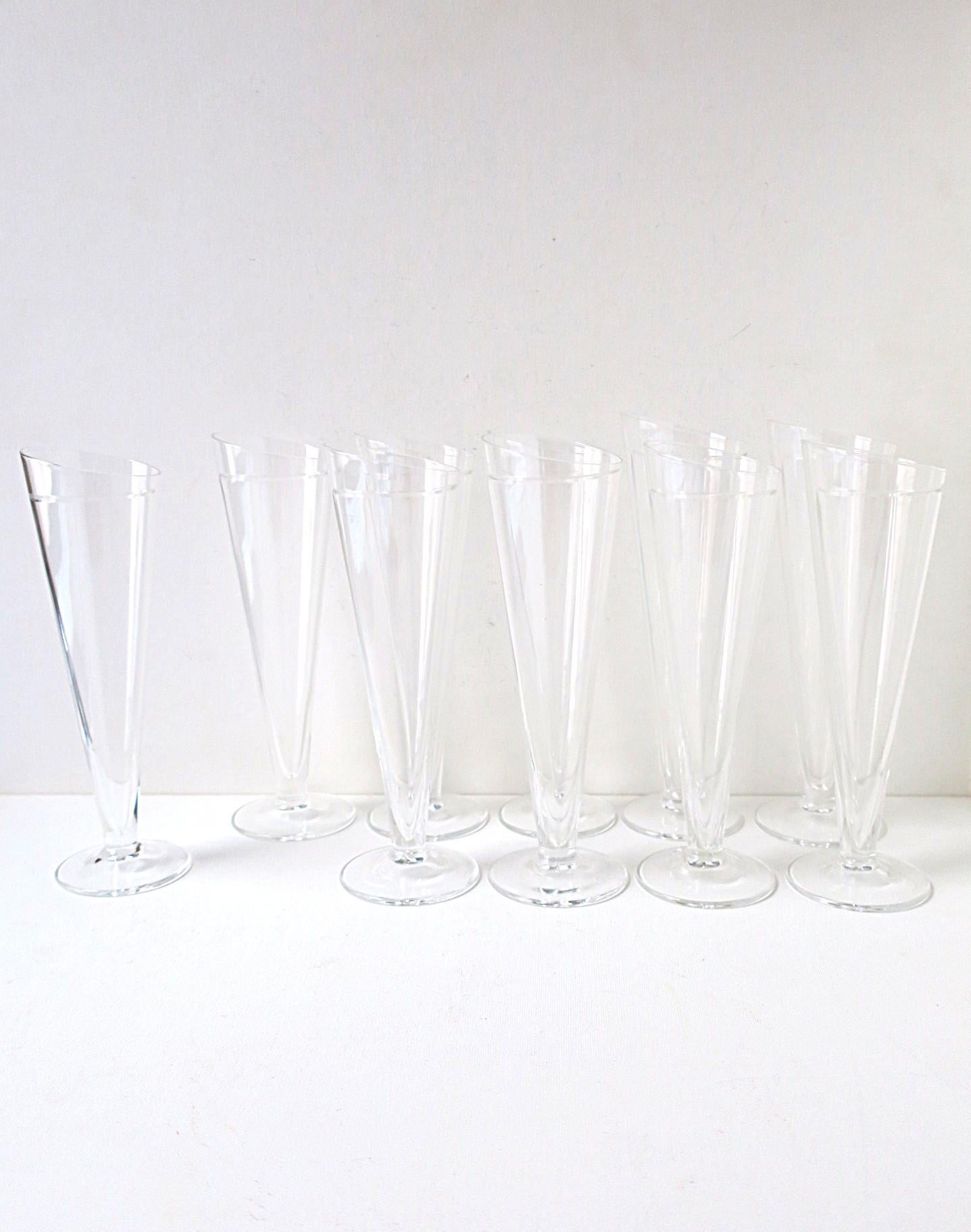 Two (2) sets of (10) available, as per listing. 

An exquisite, chic, and collectable set of ten (10) hand-crafted Italian Champagne flute glasses by Italian designer Carlo Moretti, Postmodern design period, circa late-20th century, 1980s, Italy.