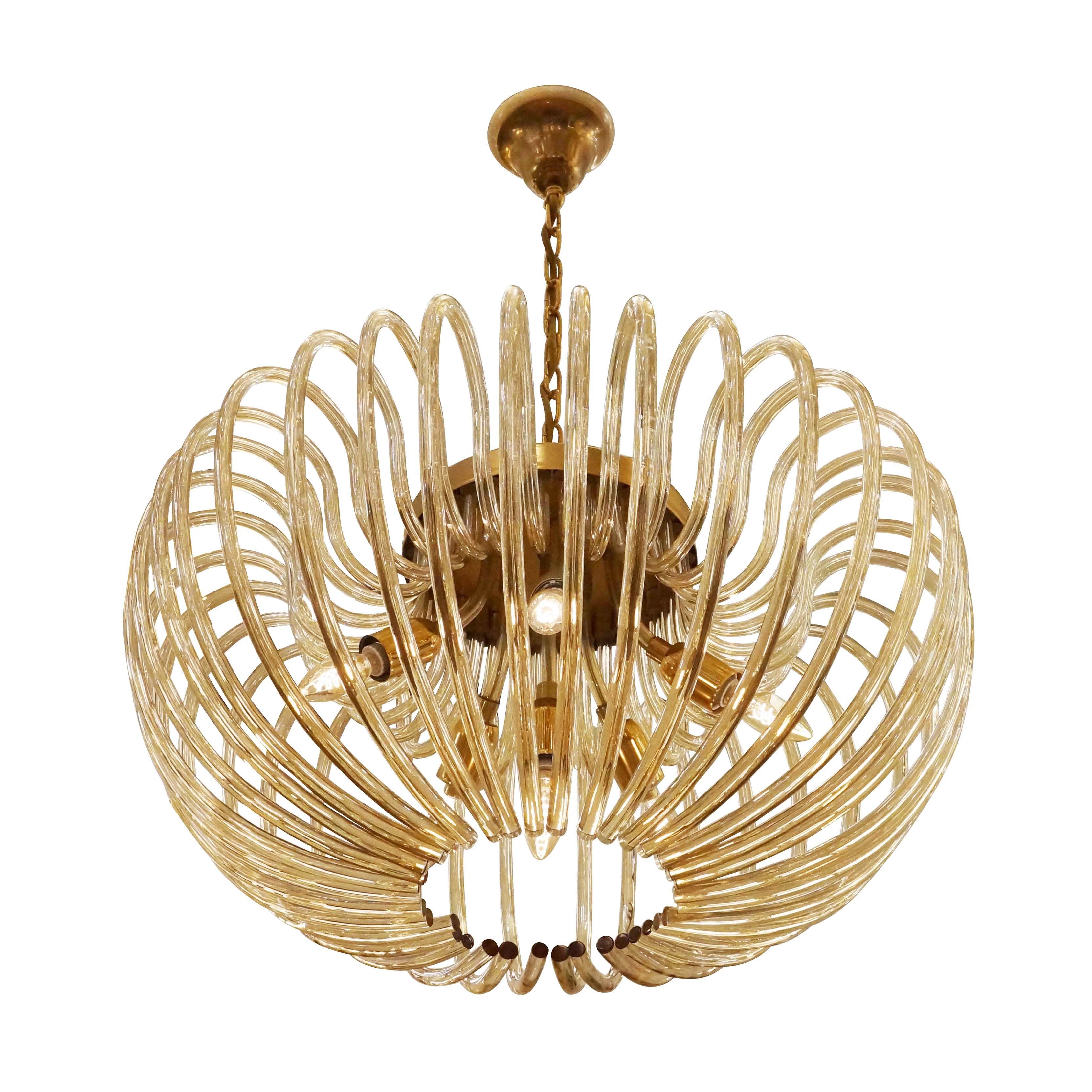 1960’s Italian Murano chandelier with dozens of curved “champagne” colored glasses. Brass hardware. Holds six light sources.

Condition: Excellent vintage condition, minor wear consistent with age and use.

Diameter: 29”

Height: 37” (adjustable)