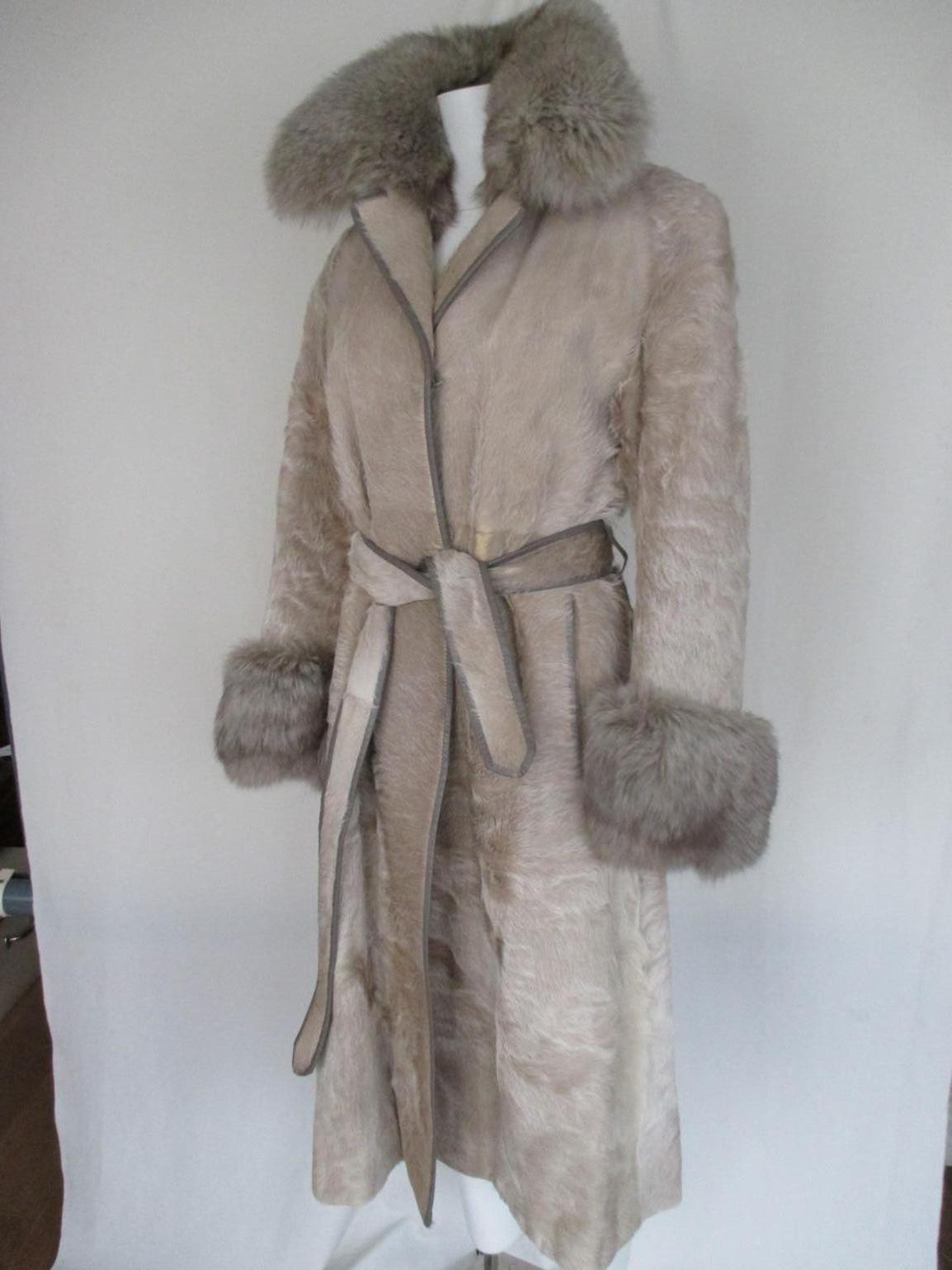 Amazing vintage coat from pony skin with fox fur collar and cuffs. 
With 2 pockets, 3 closing hooks, fully lined, leather trimmed and a matching belt.
Good preloved condition, with some signs of use.
Rare to find.
Size is about small, see section