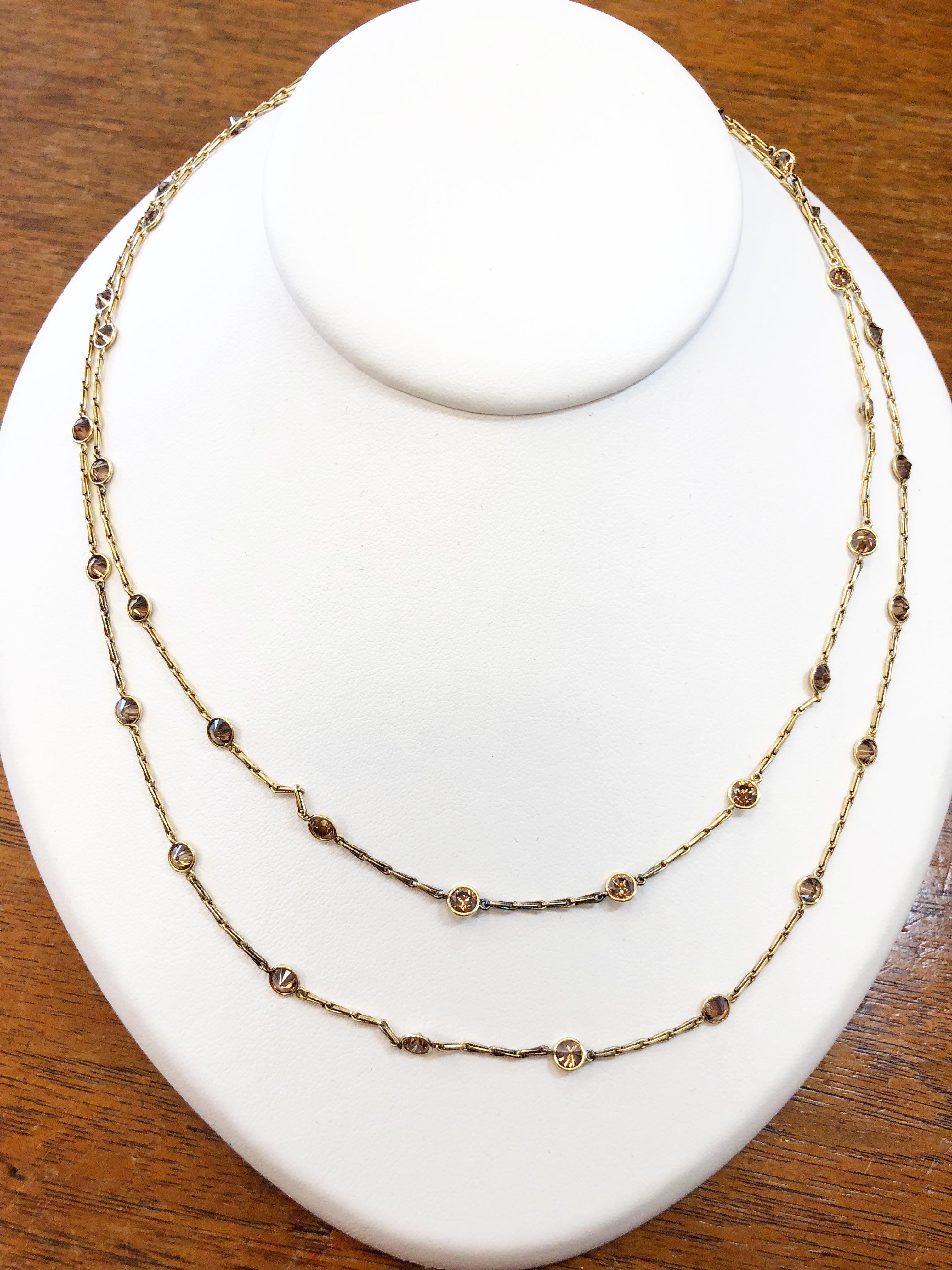 7.20 carats of round champagne diamonds in 18k yellow gold bezels and chain. Perfect item for layering with other necklaces or worn on it's own.  Length is 36 inches.  A great necklace for everyday wear because the orange/brown color of the diamonds