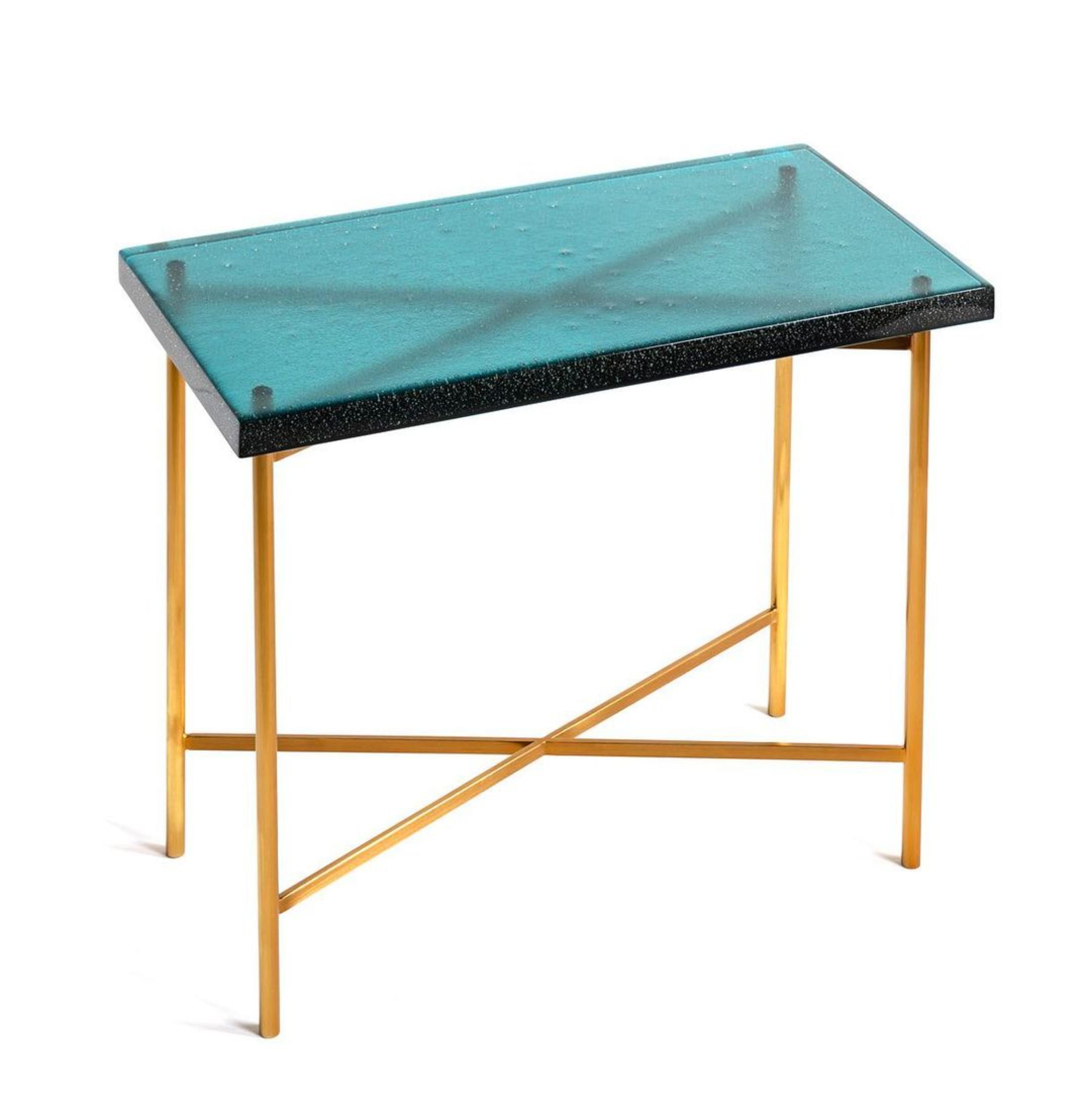 Champagne Table by The GoodMan Studio
Dimensions: W 61 x D 31 x H 53 cm 
Materials: Metal, Glass, Steel

Kilncast glass with steel base

The Goodman Studio has been internationally recognized for its modern blown glass vessels, and innovative