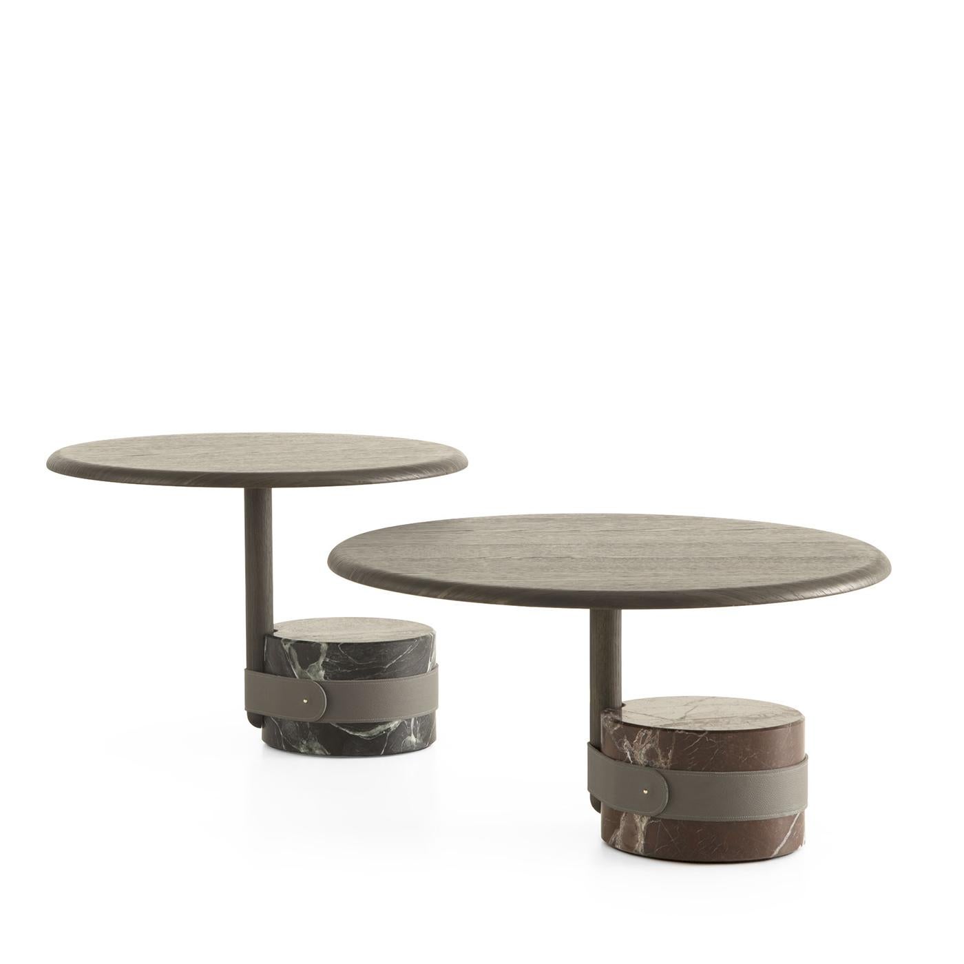 Distinguished by its red Lepanto marble base with a satin matte finish, this captivating side table epitomizes elegance. An Anthracite leather buckle adds a touch of sophistication. The solid oak structure, perfectly stained to complement the