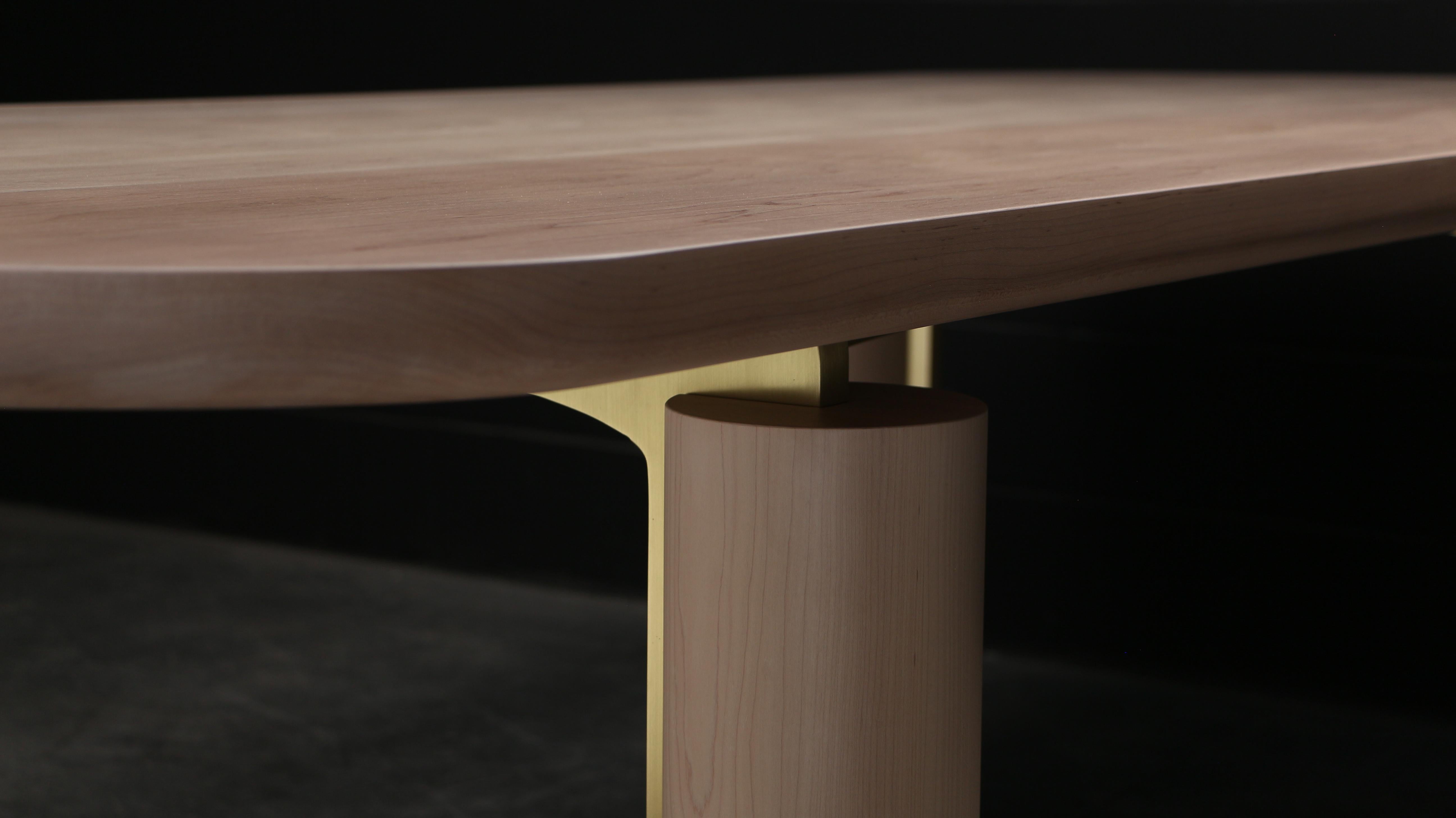The CHAMPLAIN Dining Table is a sophisticated piece, designed and handcrafted by AMBROZIA Furniture Studio in Canada from the finest solid wood and finished with a luxurious hardwax oil + Nanoceramics to enhance its rich grain. Its distinctive base