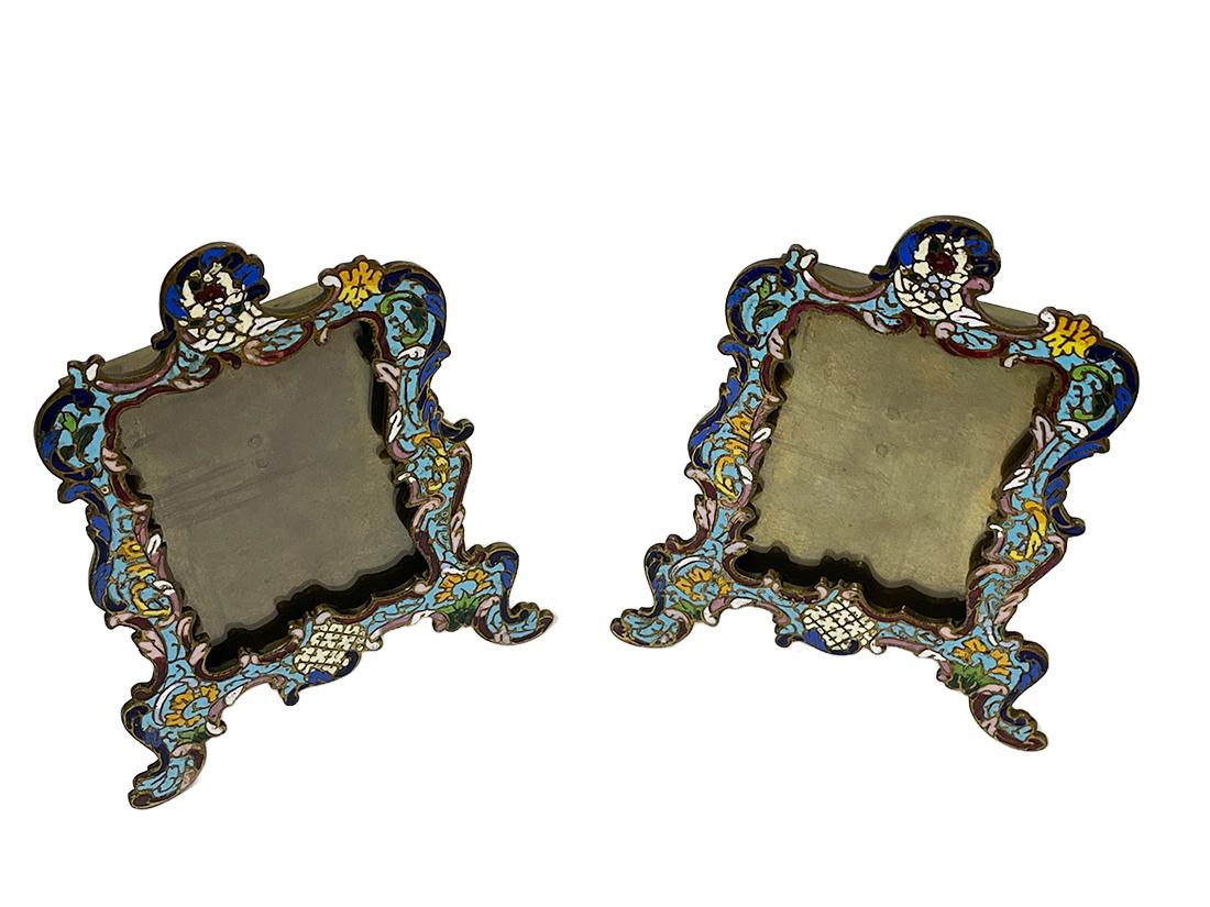 Champlevé 19th century French picture frames

Champlevé 19th Century French picture frames with easel back, decorated with foliate and floral scrolls in turquoise, cobalt, green, yellow, red, rose and white enamel
Late nineteenth/early twentieth