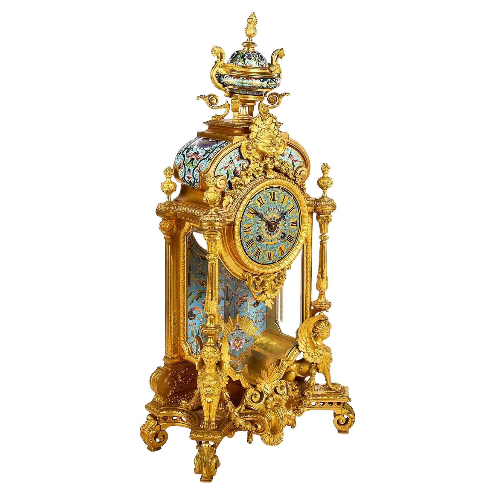 Reloj de manto de esmalte Champleve, S. XIX.