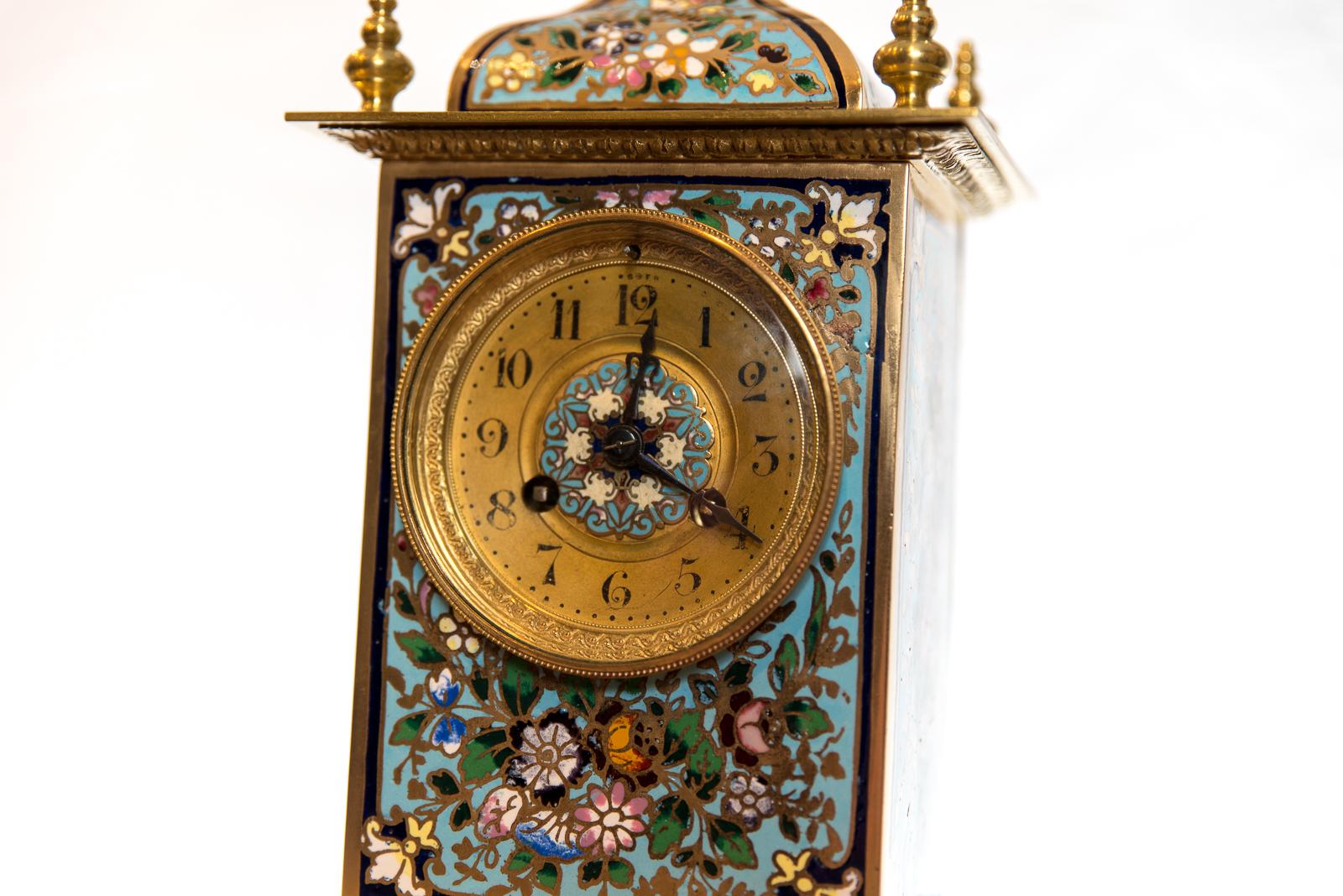An 8 day late 19th century Champlevé enamel mantel clock, striking the hours and half hours on a coiled gong. The movement signed by the makers Vincenti and Cie of Paris, France, circa 1875.