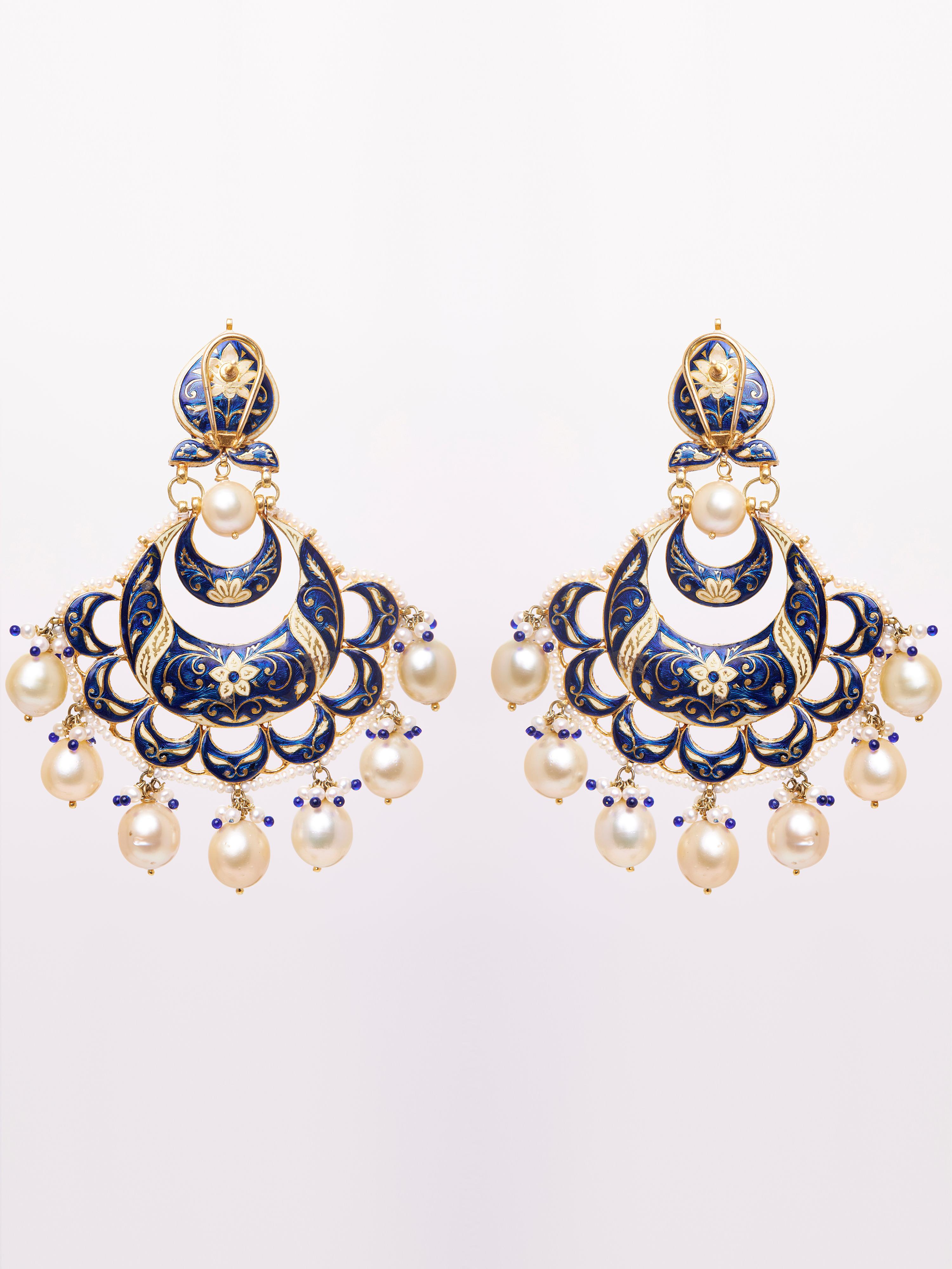 Adorn yourself in regal elegance with these exquisite Chandbali Earrings, featuring a total weight of 87.210g. Crafted with 38.14g of 18KT gold, the earrings are beautifully embellished with 6.35 carats of uncut diamonds, offering a timeless