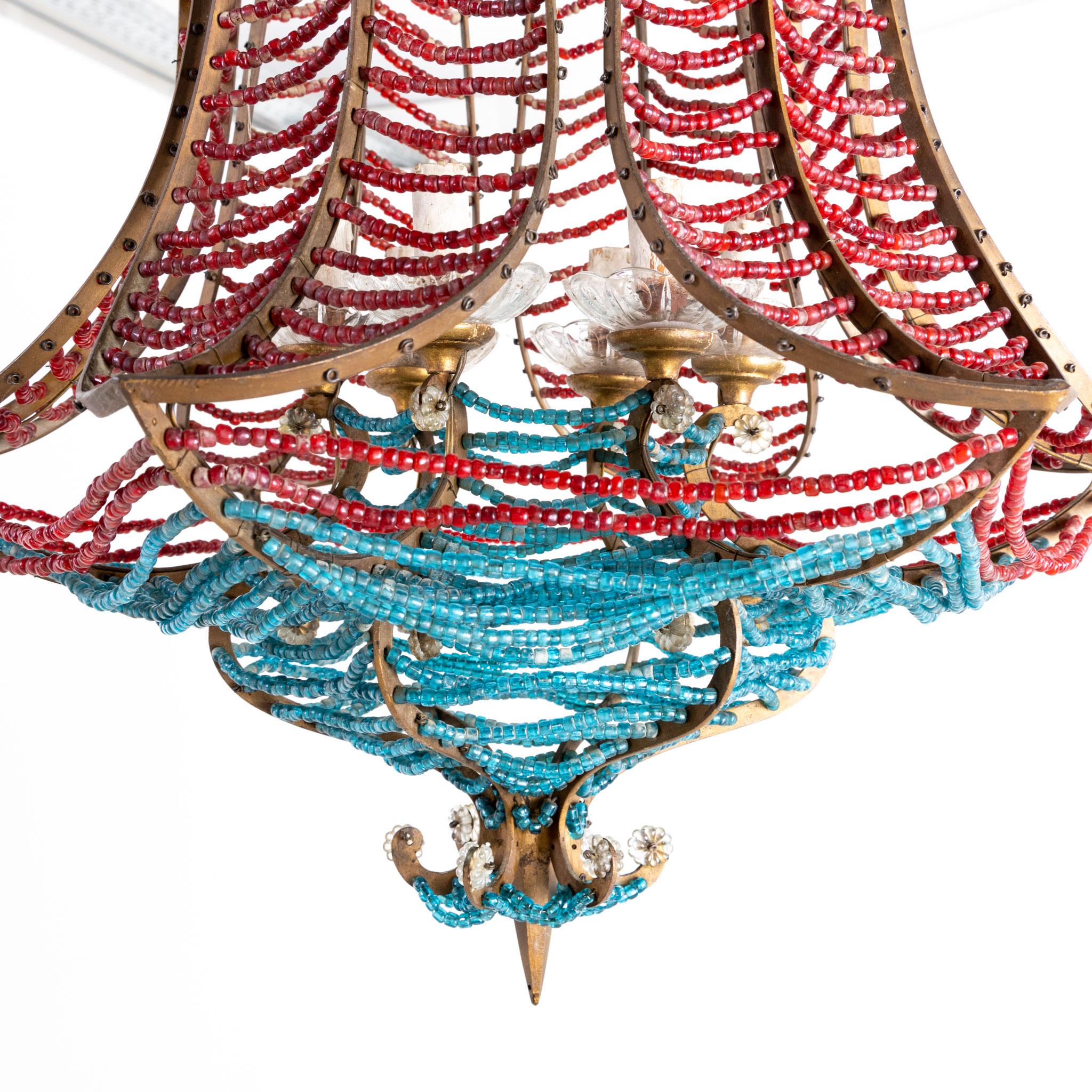 Chandelier with blue and red beads and bronze frame and six sockets.
