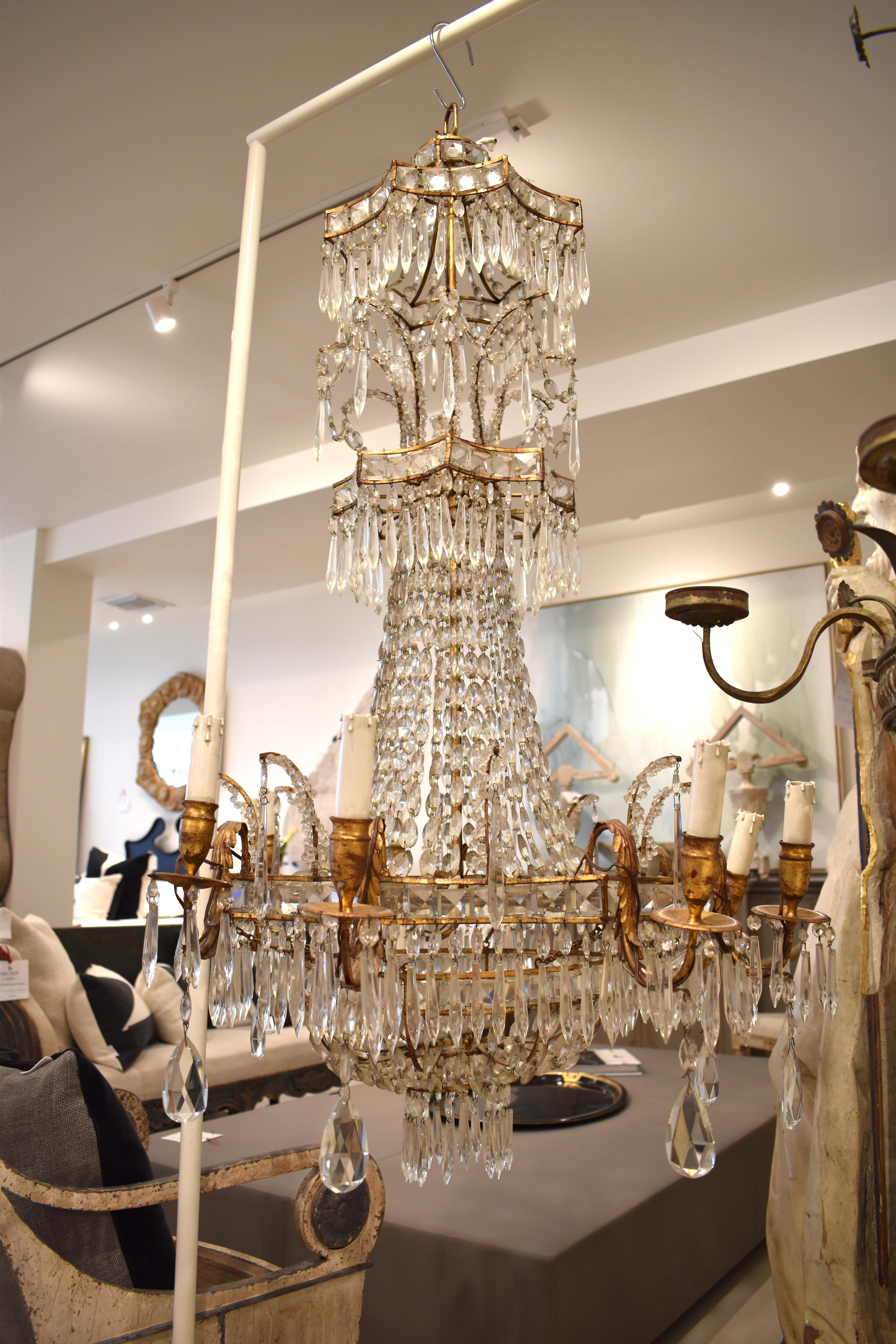 A spectacular chandelier with all the elements that create a WOW reaction. Multiple layers of a variety of crystal cuts and configurations. Beautiful proportions and extreme height make this fixture special. Needs to be rewired for US use. 