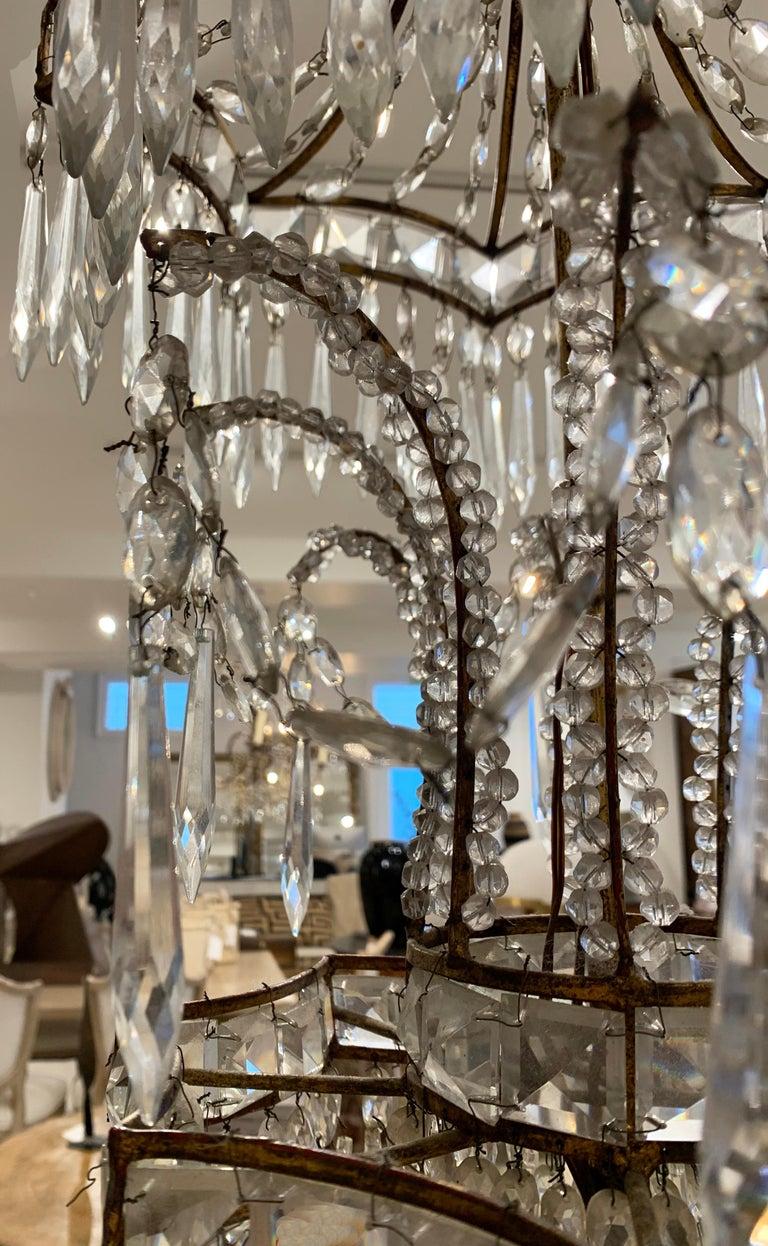 A spectacular chandelier with all the elements that create a WOW reaction. Multiple layers of a variety of crystal cuts and configurations. Beautiful proportions and extreme height make this fixture special. Needs to be rewired for US use. 