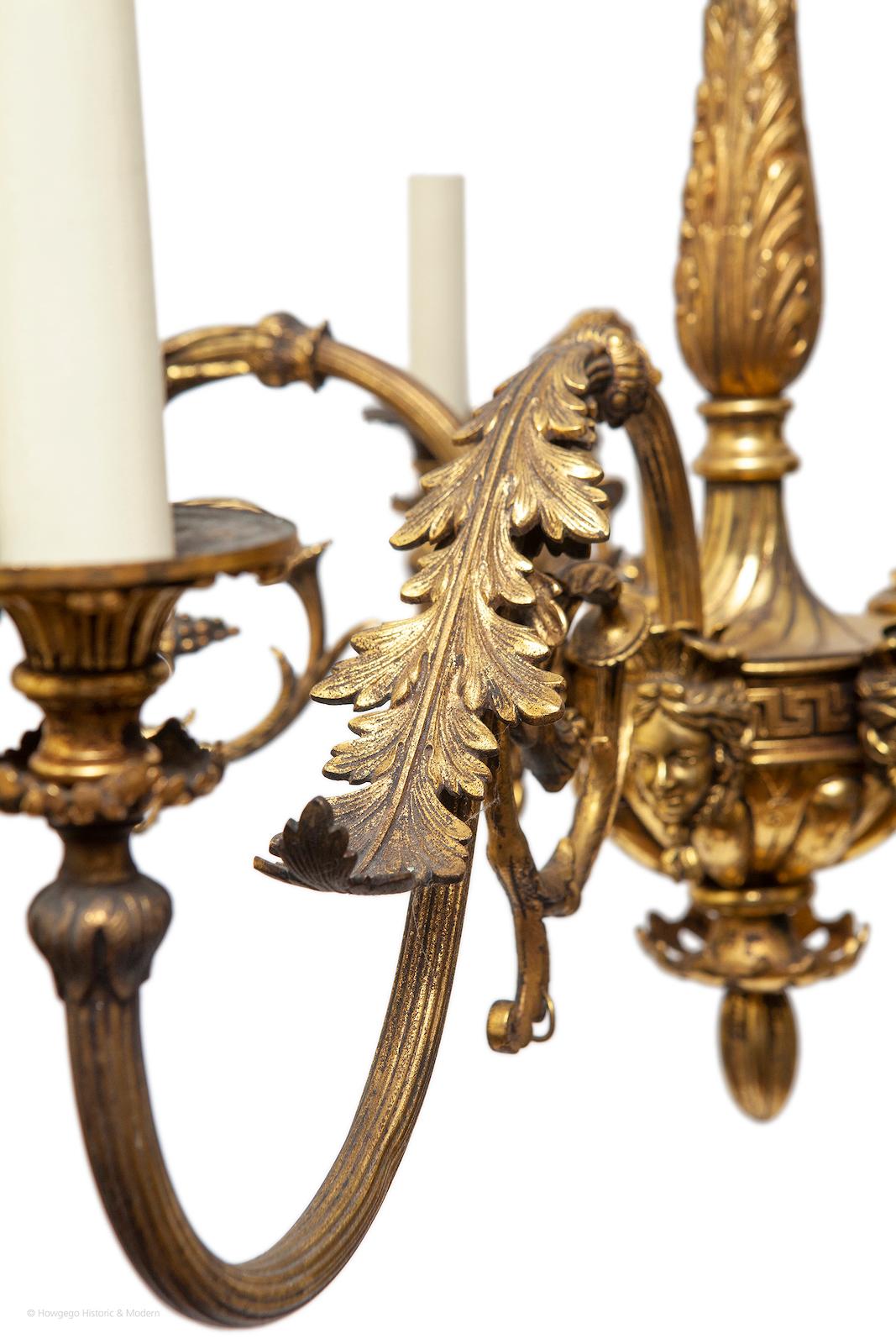 FINE, 19TH CENTURY, NEO-CLASSICAL, ORMOLU CHANDELIER, WITH 5 BRANCHES HEADED BY FEMALE MASKS, ELECTRIFIED, 31” high, 25” diameter

- Injects classical elegance, grandeur and atmosphere into the interior
- Particularly fine detail and working, the