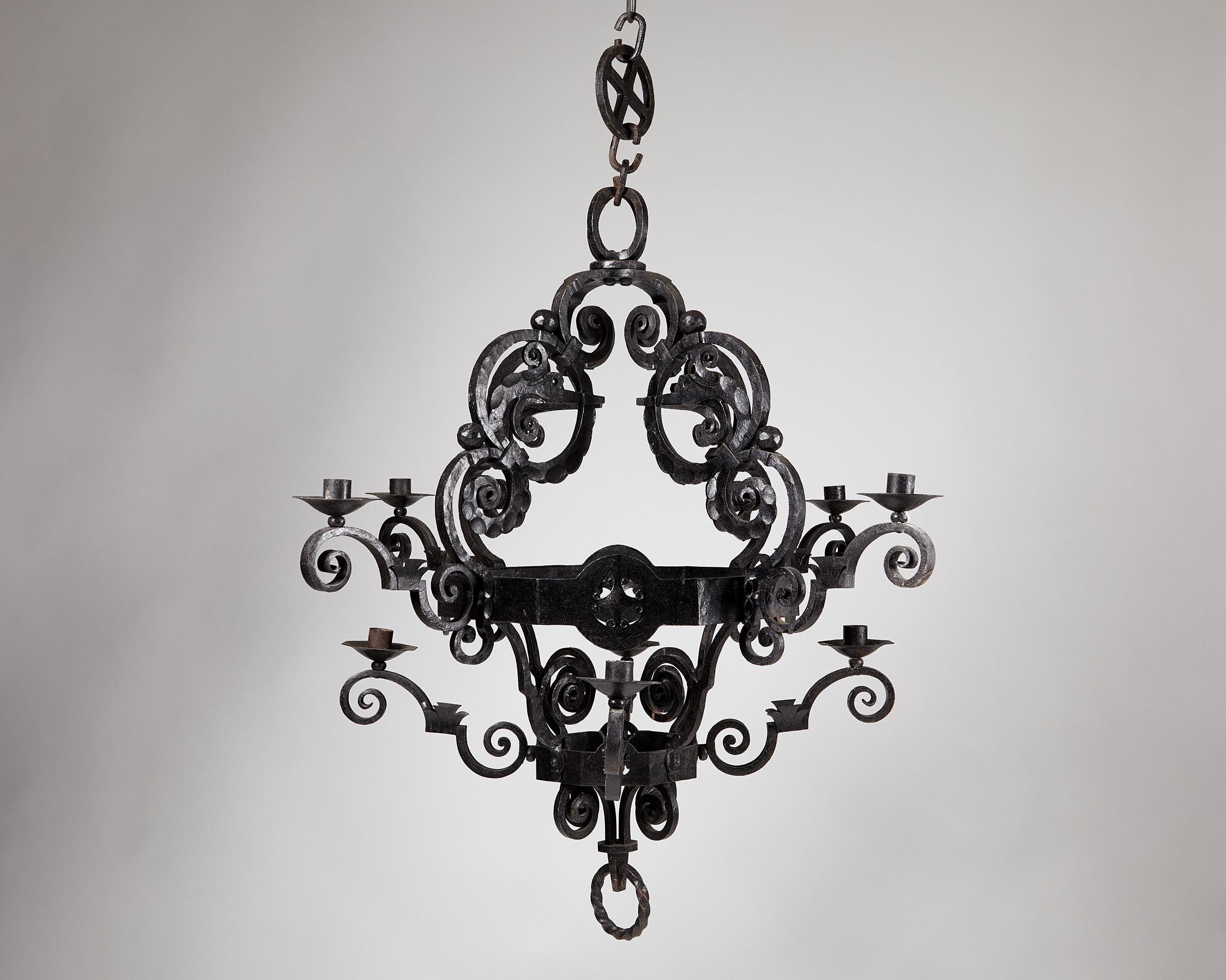 Chandelier, anonymous. 
Sweden. Early 1900s.

Forged iron.

'Old Nordic' in style.

Measurements
H: 104 cm/ 3' 4