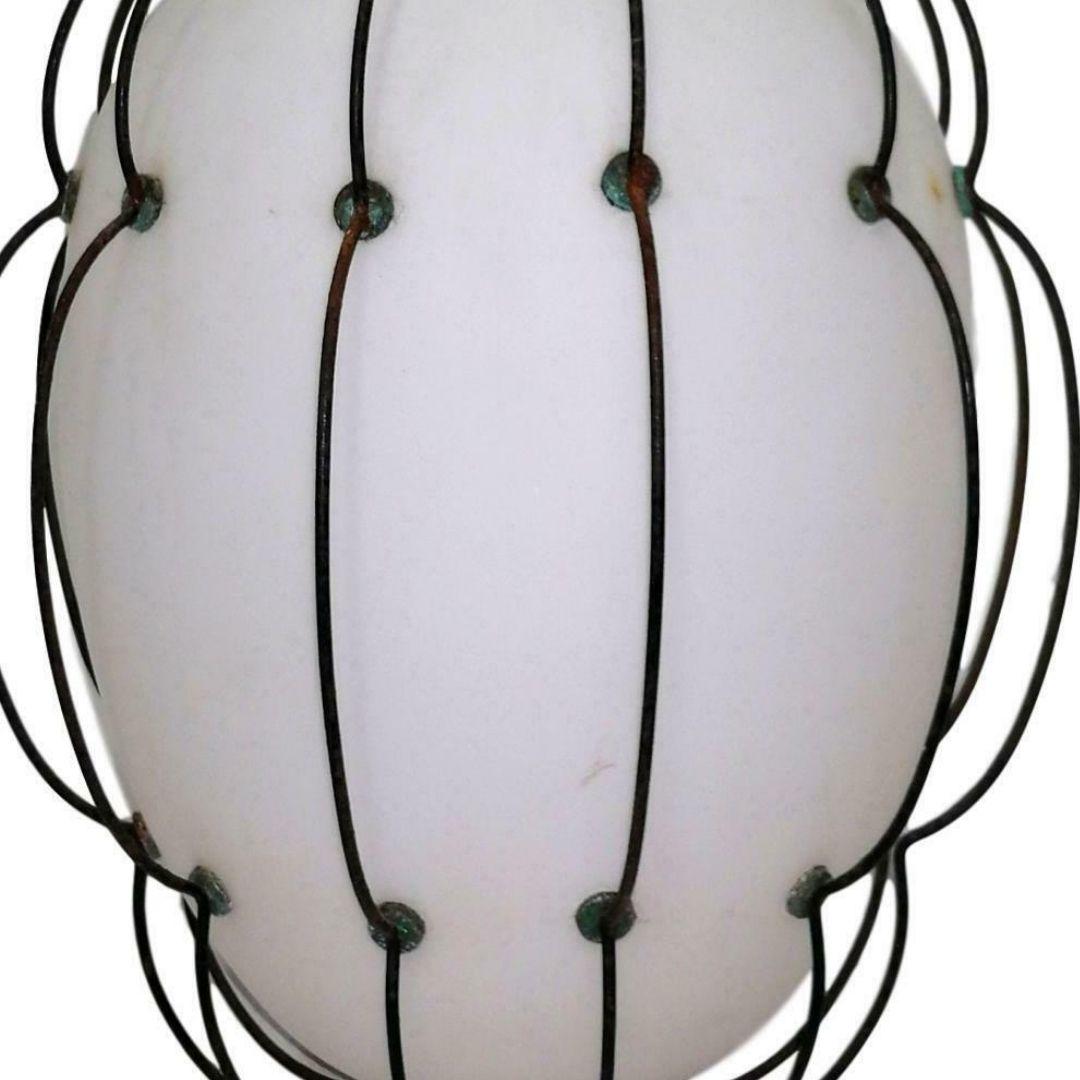 Splendid 1950s chandelier, probably designed by Angelo lelli for Arredoluce

made of white opal glass in a hooked wire mesh cage 

literature: 