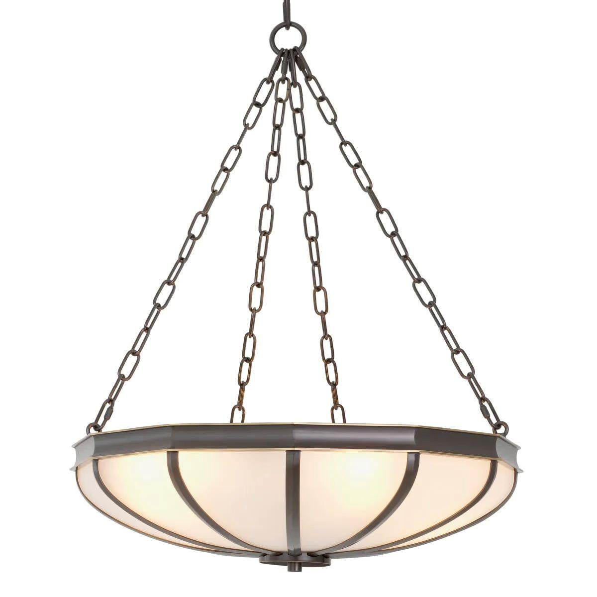 Il lampadario è un apparecchio d'illuminazione compatto ma di grande effetto che aggiunge un'eleganza scultorea a qualsiasi interno. Whiting, con una finitura in bronzo abbinata a un delicato vetro bianco, questo lampadario offre un ambiente