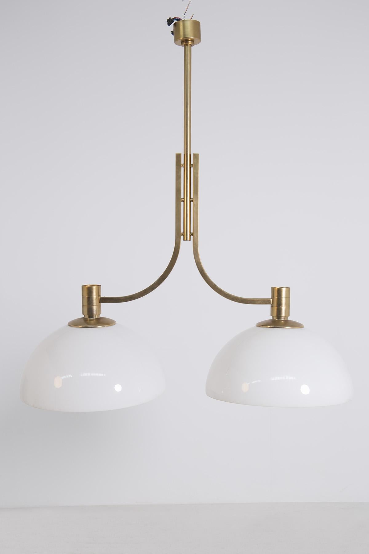 Large ceiling lamp by Sirrah Italia, designed by Franco Albini and Franca Helg 1970s. The large ceiling lamp is in perfect condition. Franco Albini's chandelier is a rare adjustable type, i.e. the two ceiling lights can be adjusted up or down as