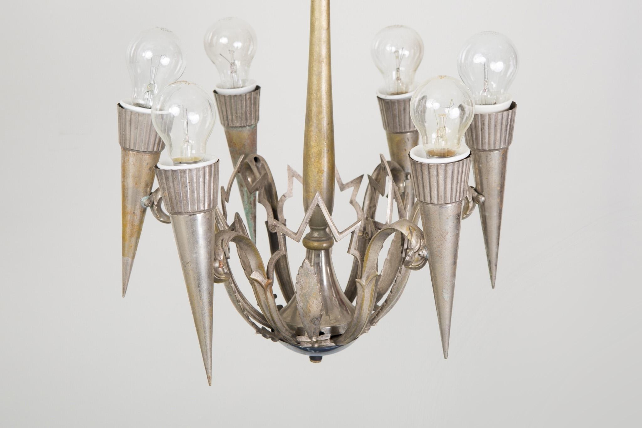 Franta Anyz chandelier made out of nickel plated brass in the 1920s
Original pristine condition. No damages.
Rare design.

We guarantee safe a the cheapest air transport from Europe to the whole world within 7 days.
The price is the same as for