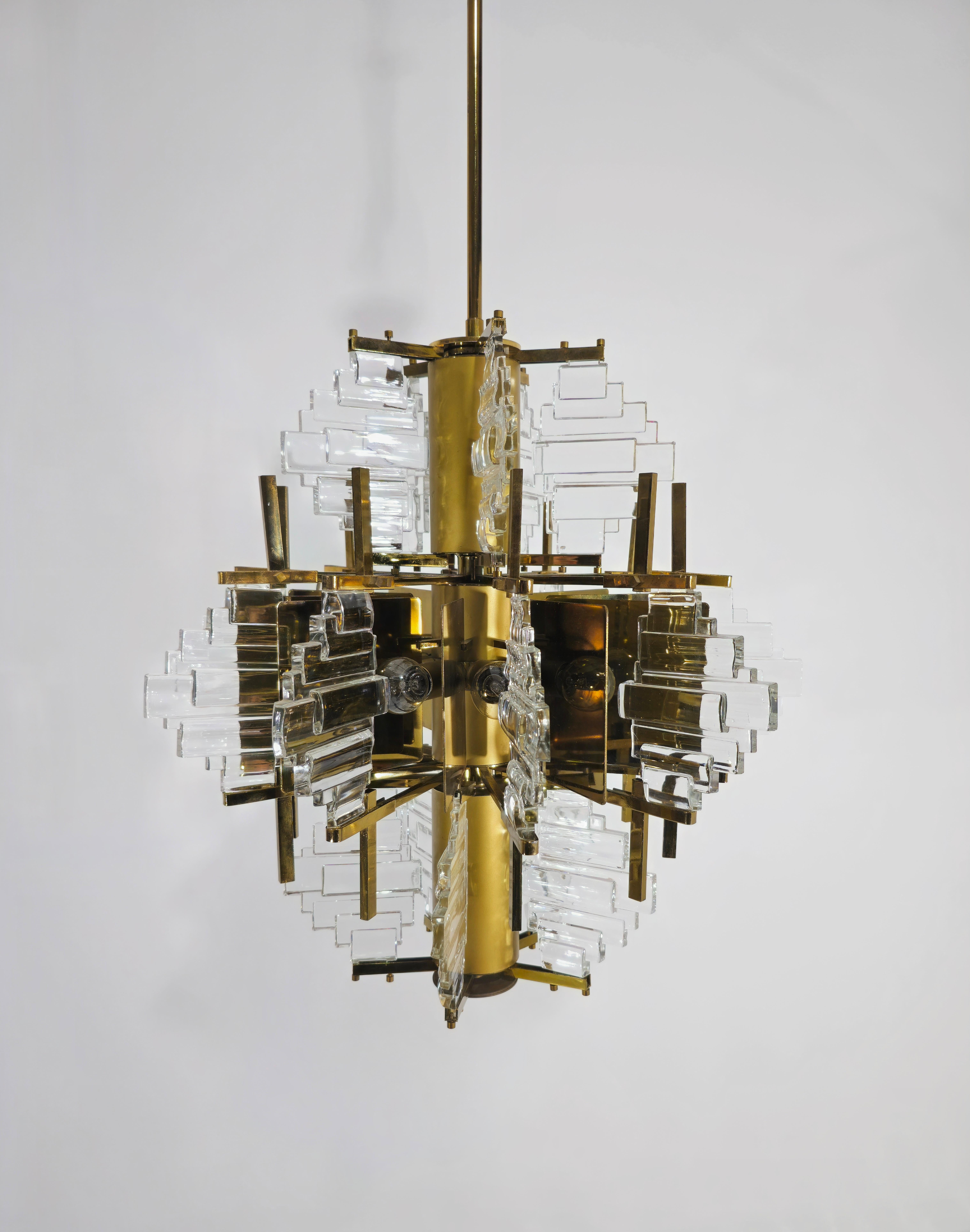 Chandelier by Gaetano Sciolari glass and steel Gilded. Twenty glasses distributed on three levels with embellishment of golden plates. Illuminated by ten lights positioned in the central part. Truly particular this lighting. Please watch the video
