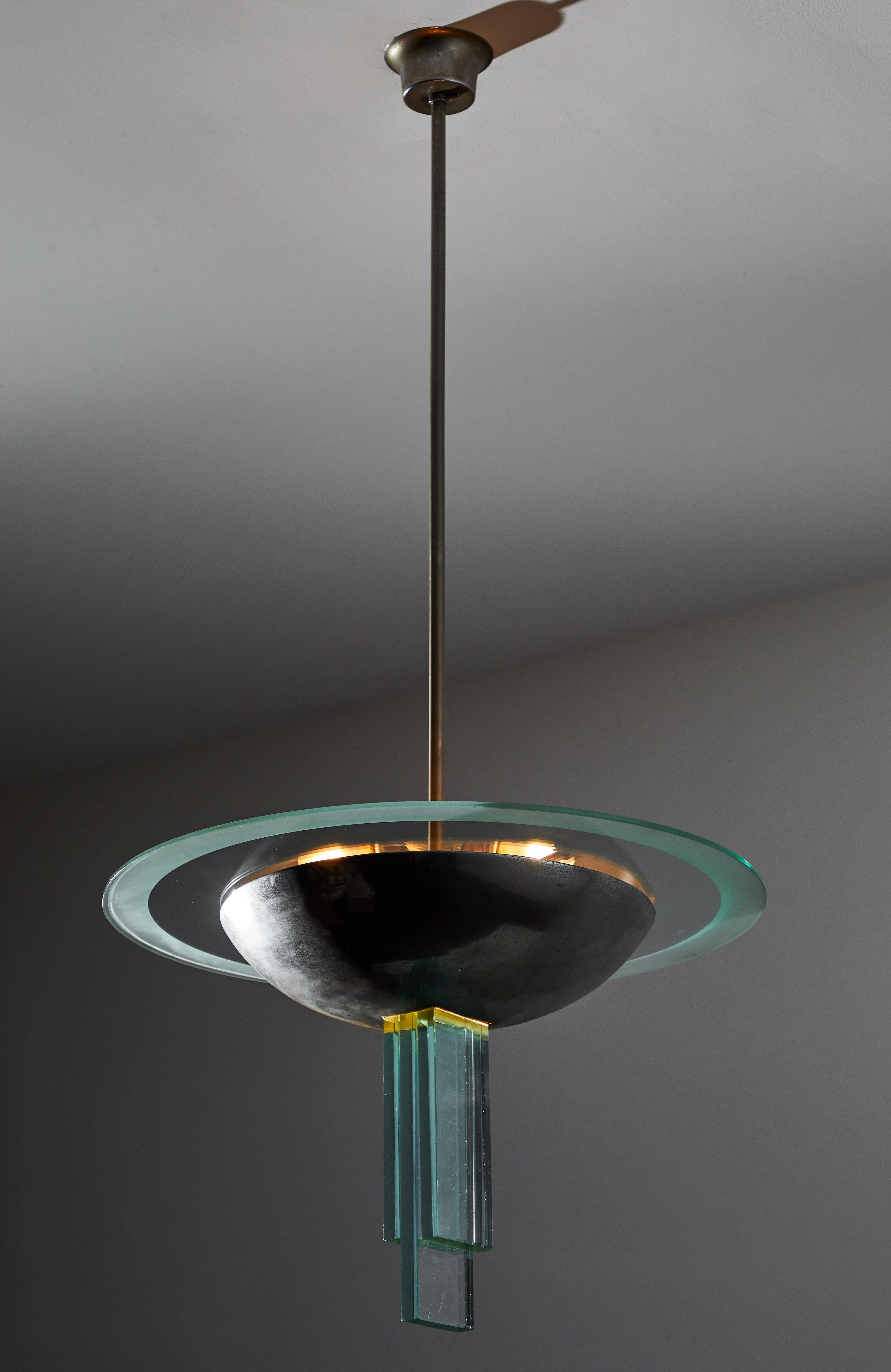 Suspension light attributed to Pietro Chiesa for Fontana Arte. Designed and manufactured in Italy, circa 1946. Naturally patinated, nickel plated steel and glass. Interior of nickel shade and three glass structures at base of light illuminate.