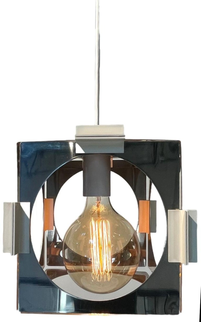 A stately and fun design by entrepreneur Goffredo Reggini. 

Reggiani founded his eponymous lighting factory in Brianza, Italy, a region known for its tradition in industry. In his designs, Reggiani utilized mainly chrome, as well as opaline glass