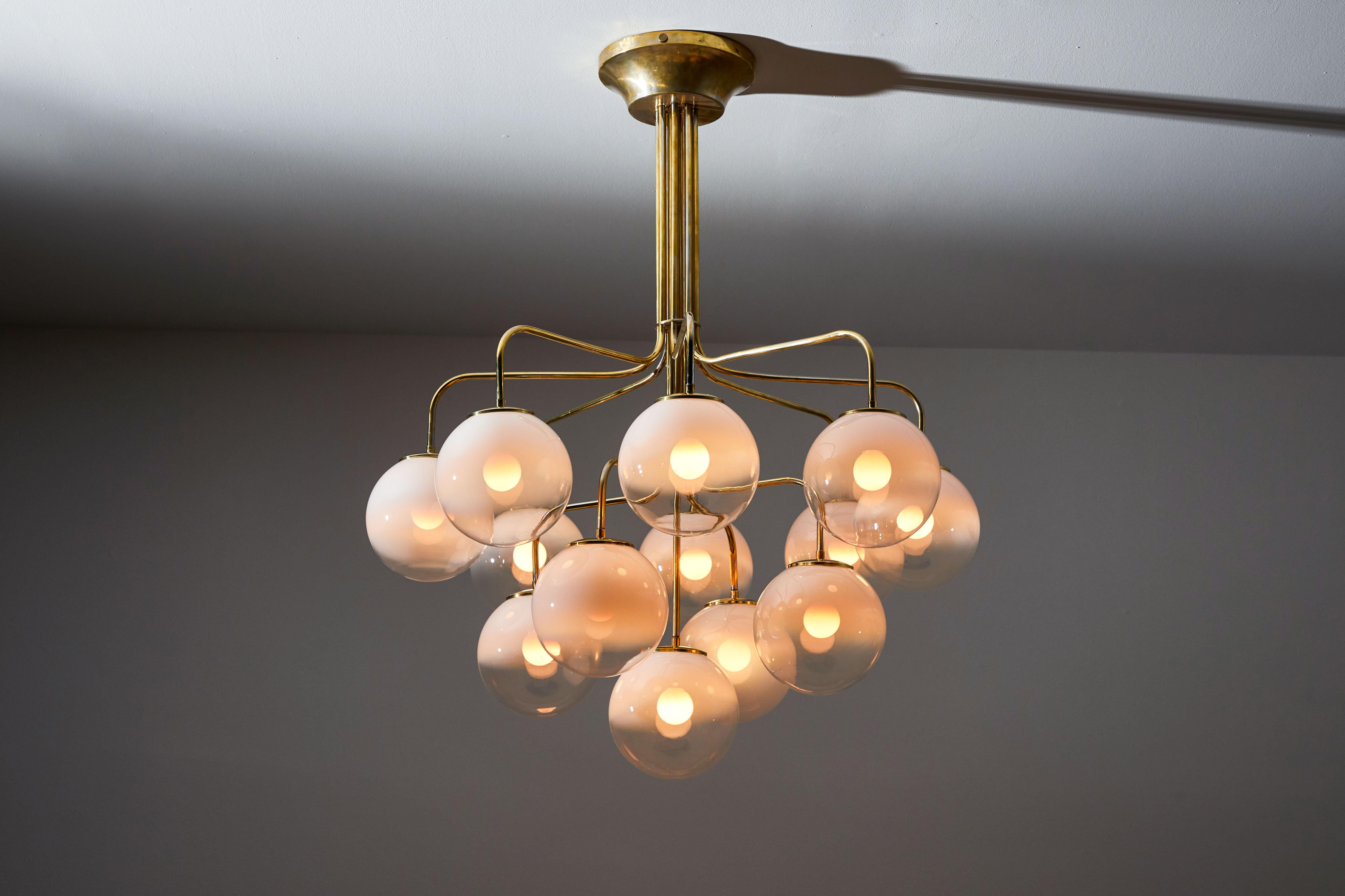 Thirteen globe chandelier by Angelo Mangiarotti for Candle. Designed and manufactured in Italy, circa 1960s. Brass with hand blown two-toned opaque Murano globes. Rewired for US junction boxes. Each globe takes one E27 25w maximum bulbs. Bulbs