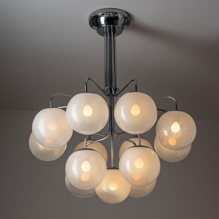 Chandelier by Angelo Mangiarotti for Candle. Designed in Italy, circa 1960s. Chrome-plated brass and aluminium. Custom backplate, original canopy. Handblown Murano glass globes. Wired for U.S. standards. We recommend thirteen E14 25w maximum bulbs.