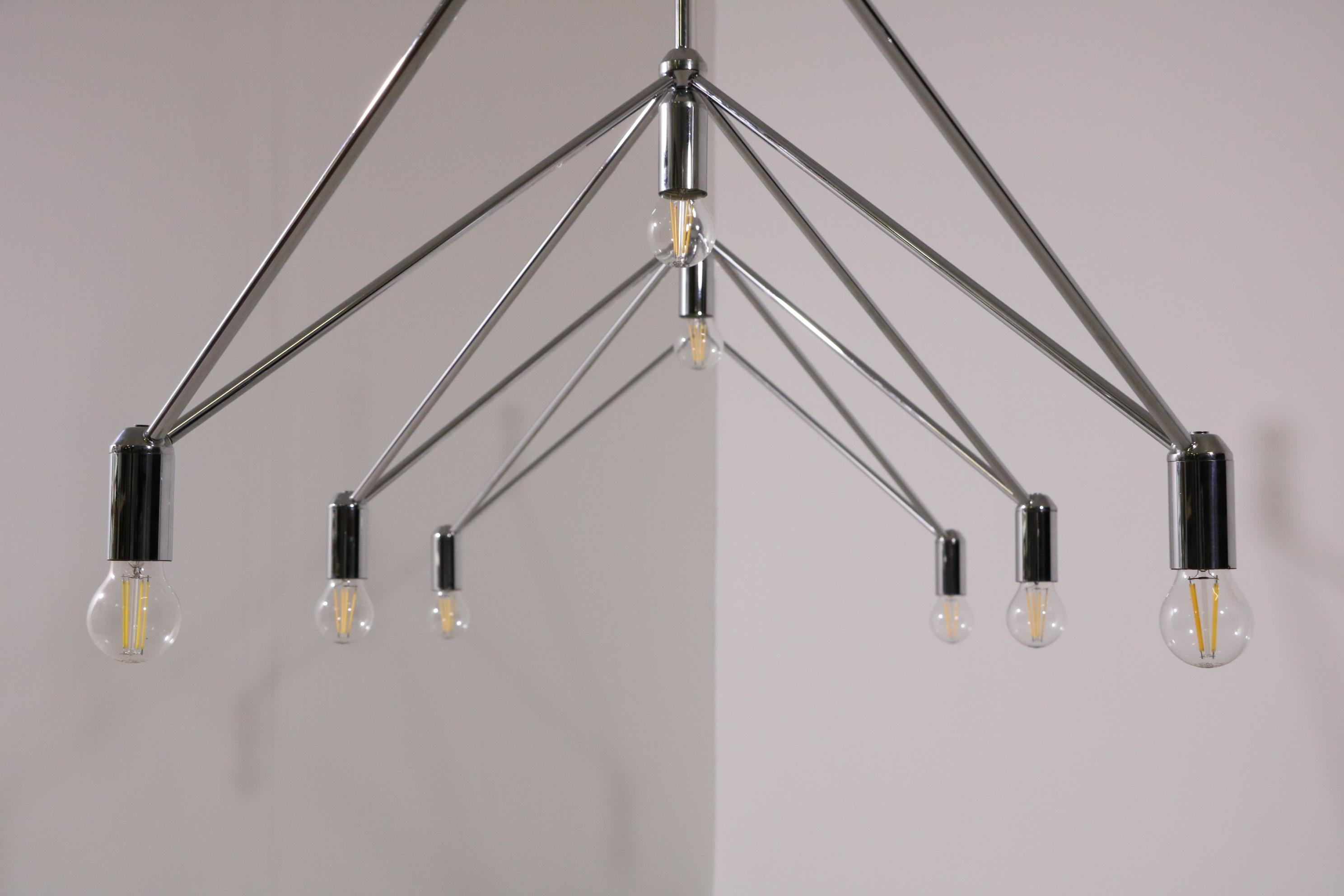 Chandelier/ceiling light Kinkeldey Studio for Verre Lumière 1970s


Chrome-plated brass, 10 x socket for bulb.
Other, arbitrary configurations possible on request.
  