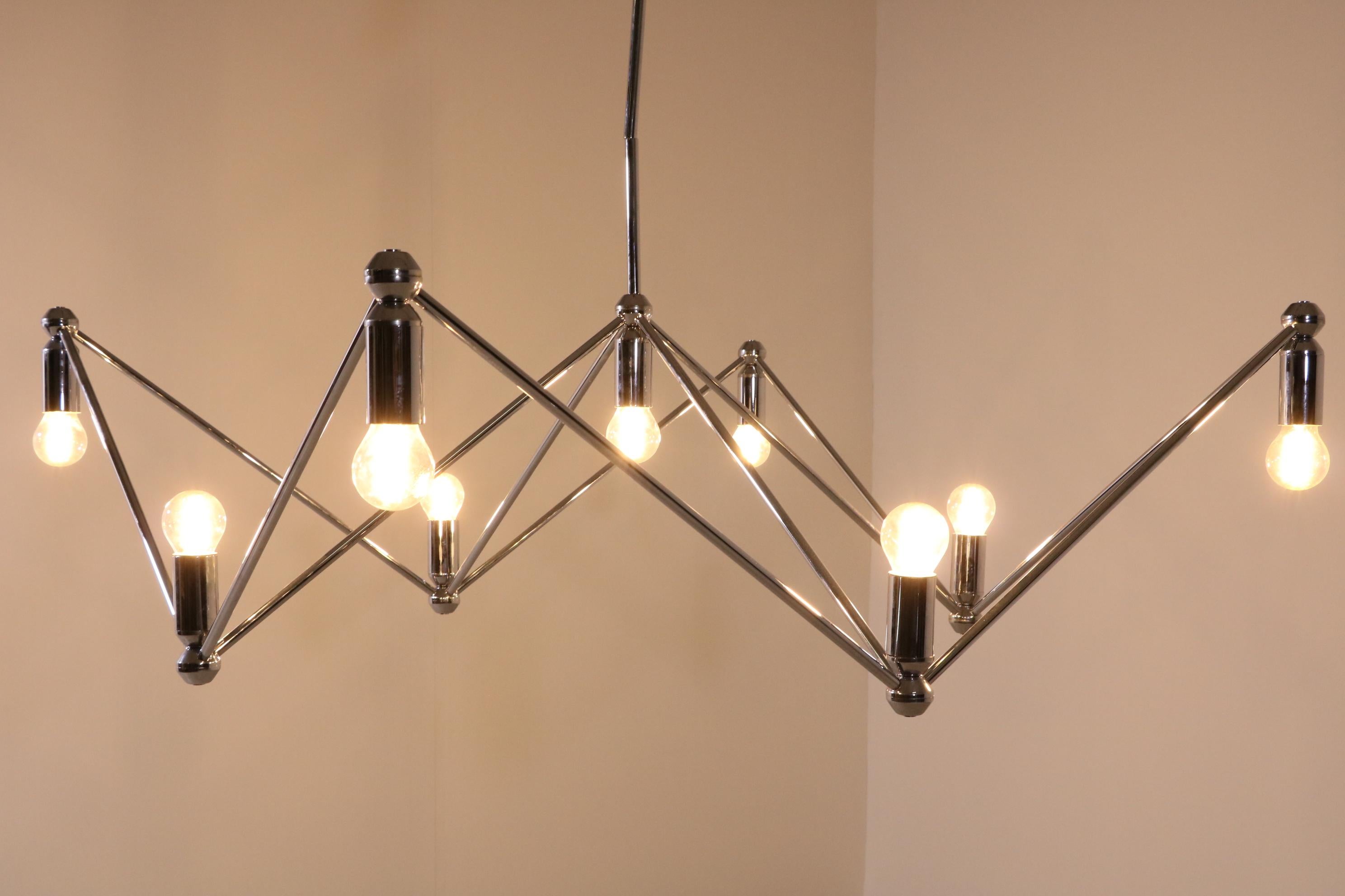 Chandelier/Ceiling Light by Kinkeldey Studio produced by Atelier Verre Lumiere. France, 1970

Chrome-plated brass, 9 x socket for bulb.

Other, arbitrary configurations possible on request.
