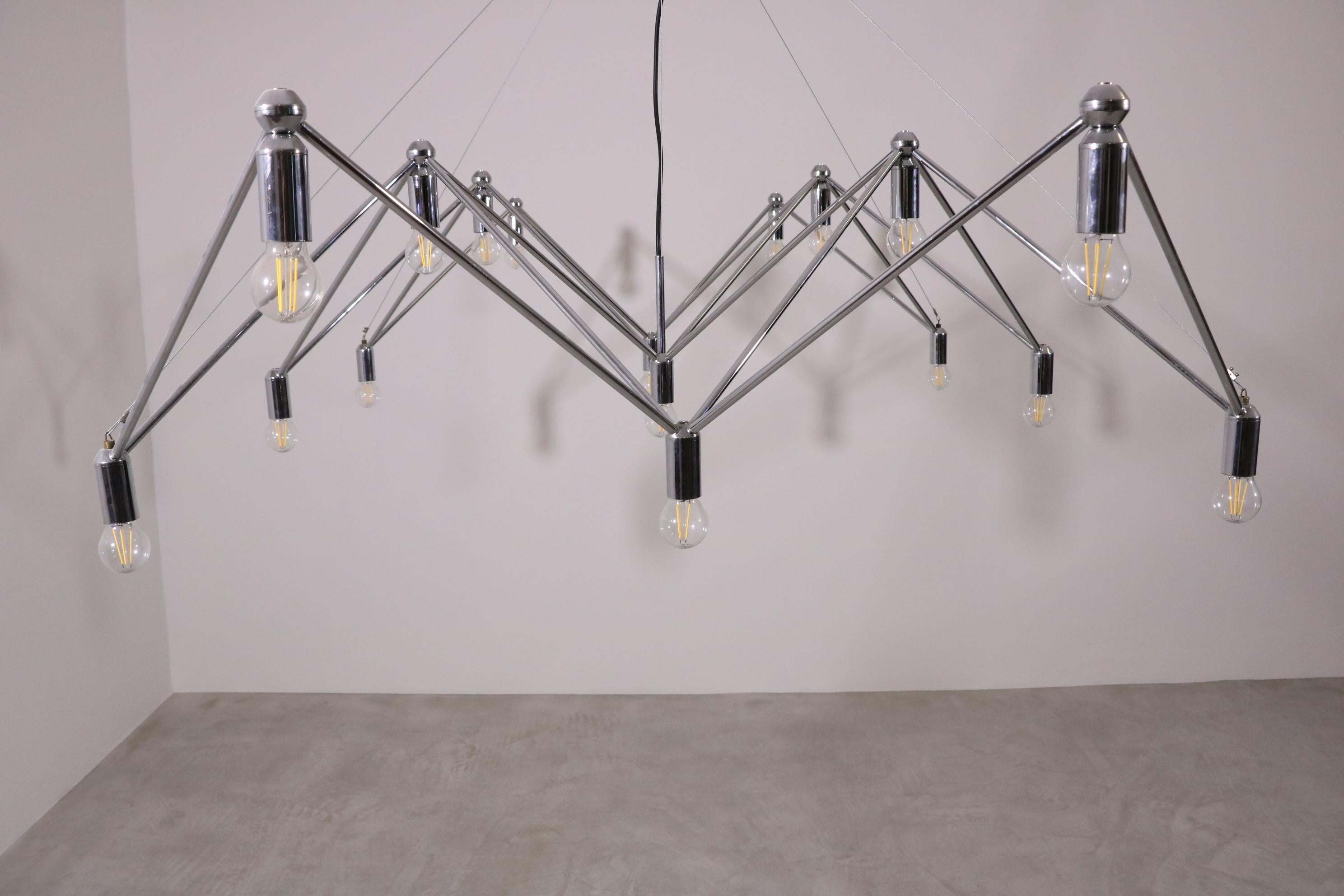 Chandelier/Ceiling Light by Kinkeldey Studio produced by Atelier Verre Lumiere. France, 1970

Chrome-plated brass, 17 x socket for bulb.

Other, arbitrary configurations possible on request.